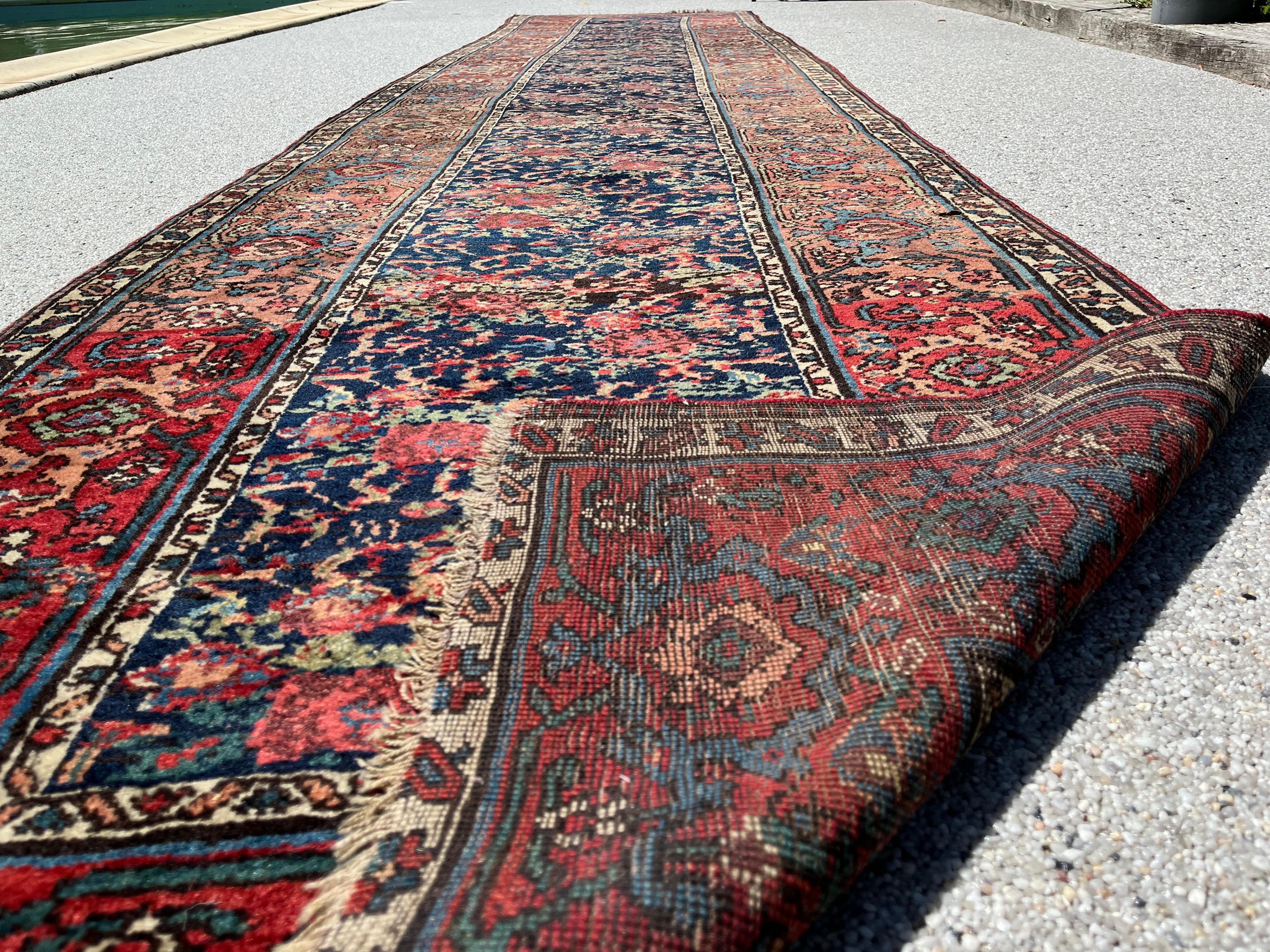 Antique Persian Bidjar Halvai runner, Circa 1900.

A highly original stylized border design is an exceptionally artful feature of this exquisitely crafted antique Bidjar rug. We can observe its distinctive patterns said Herati & Golfarang.
A