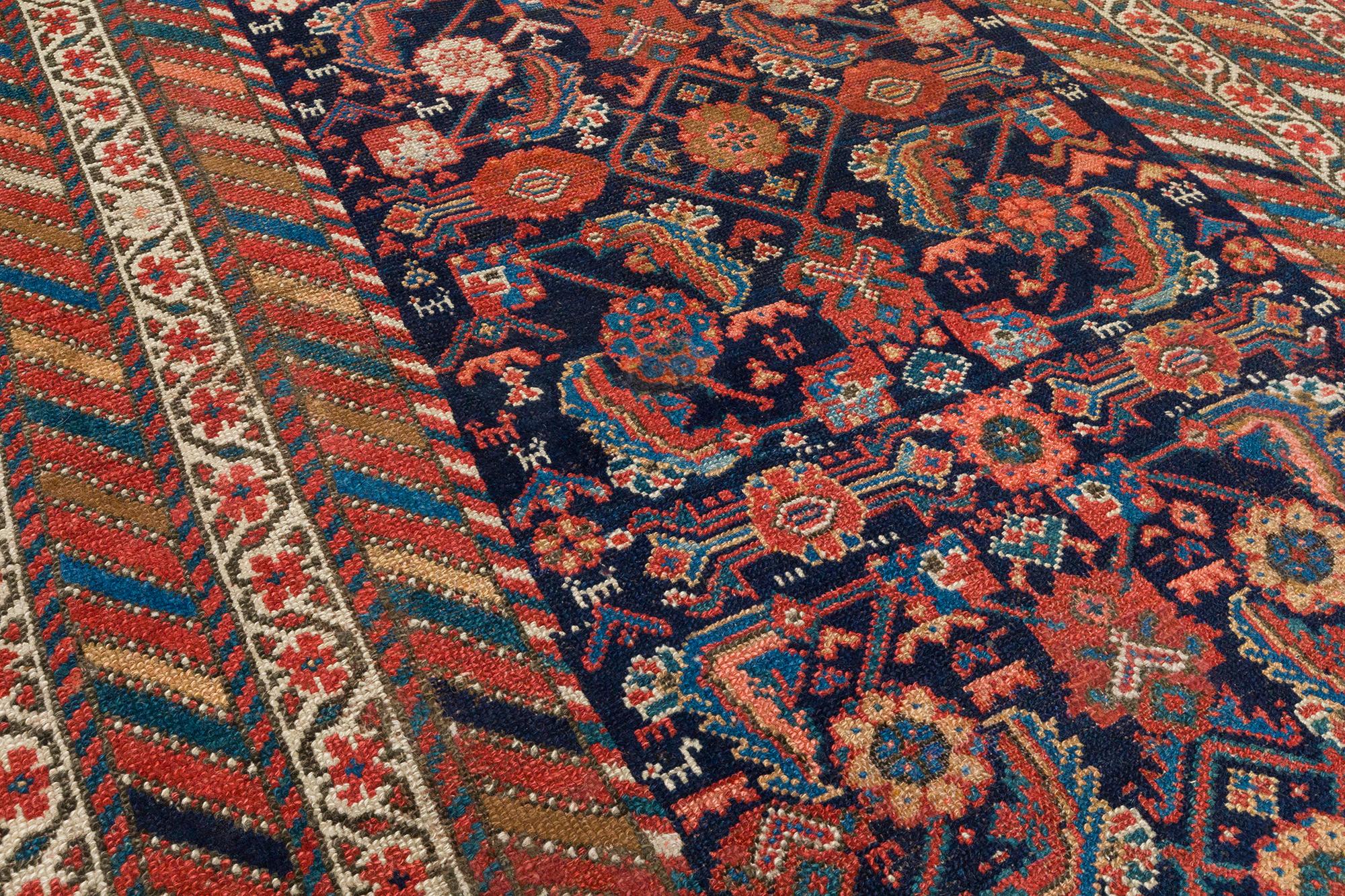 This antique Malayer rug is skillfully sourced by N A S I R I through extensive travel, passion, and research.  Malayer rugs are named after a major rug weaving village in central west Iran.  The village was known for producing extremely fine rugs