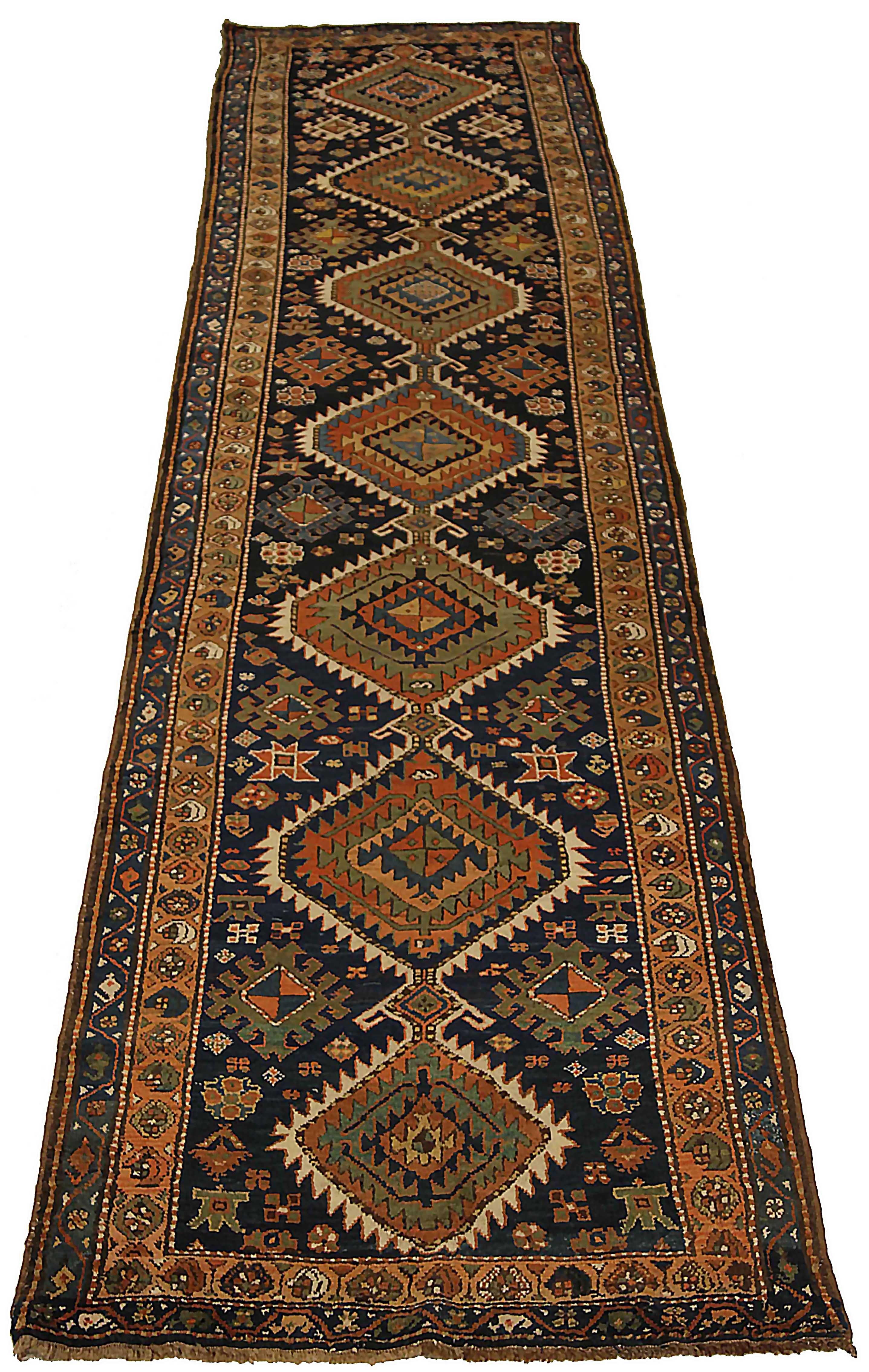 Antique Persian runner rug handwoven from the finest sheep’s wool. It’s colored with all-natural vegetable dyes that are safe for humans and pets. It’s a traditional Azarbaijan design handwoven by expert artisans. It’s a lovely runner rug that can