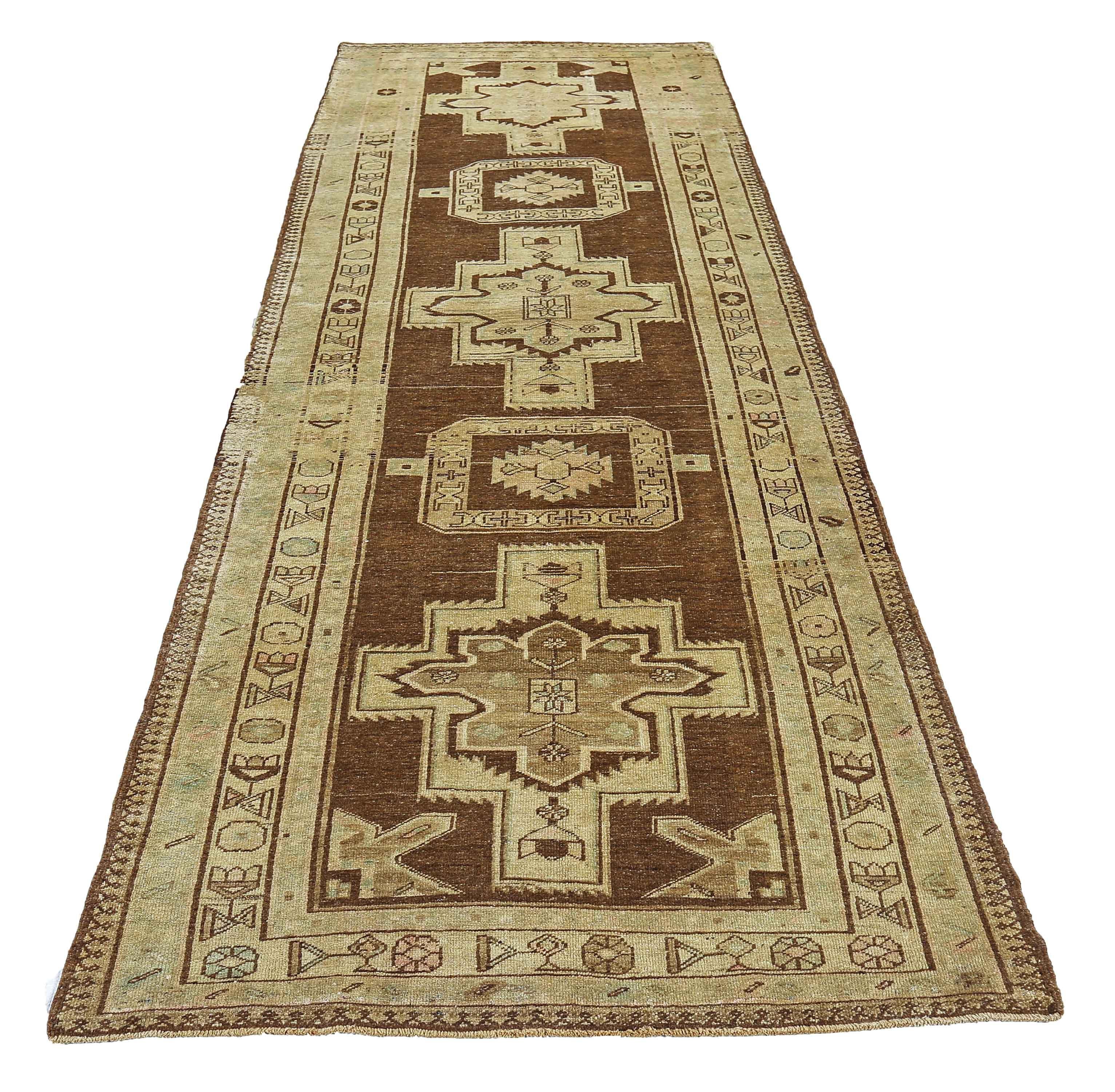 Antique Persian runner rug handwoven from the finest sheep’s wool. It’s colored with all-natural vegetable dyes that are safe for humans and pets. It’s a traditional Azerbaijan design handwoven by expert artisans. It’s a lovely runner rug that can