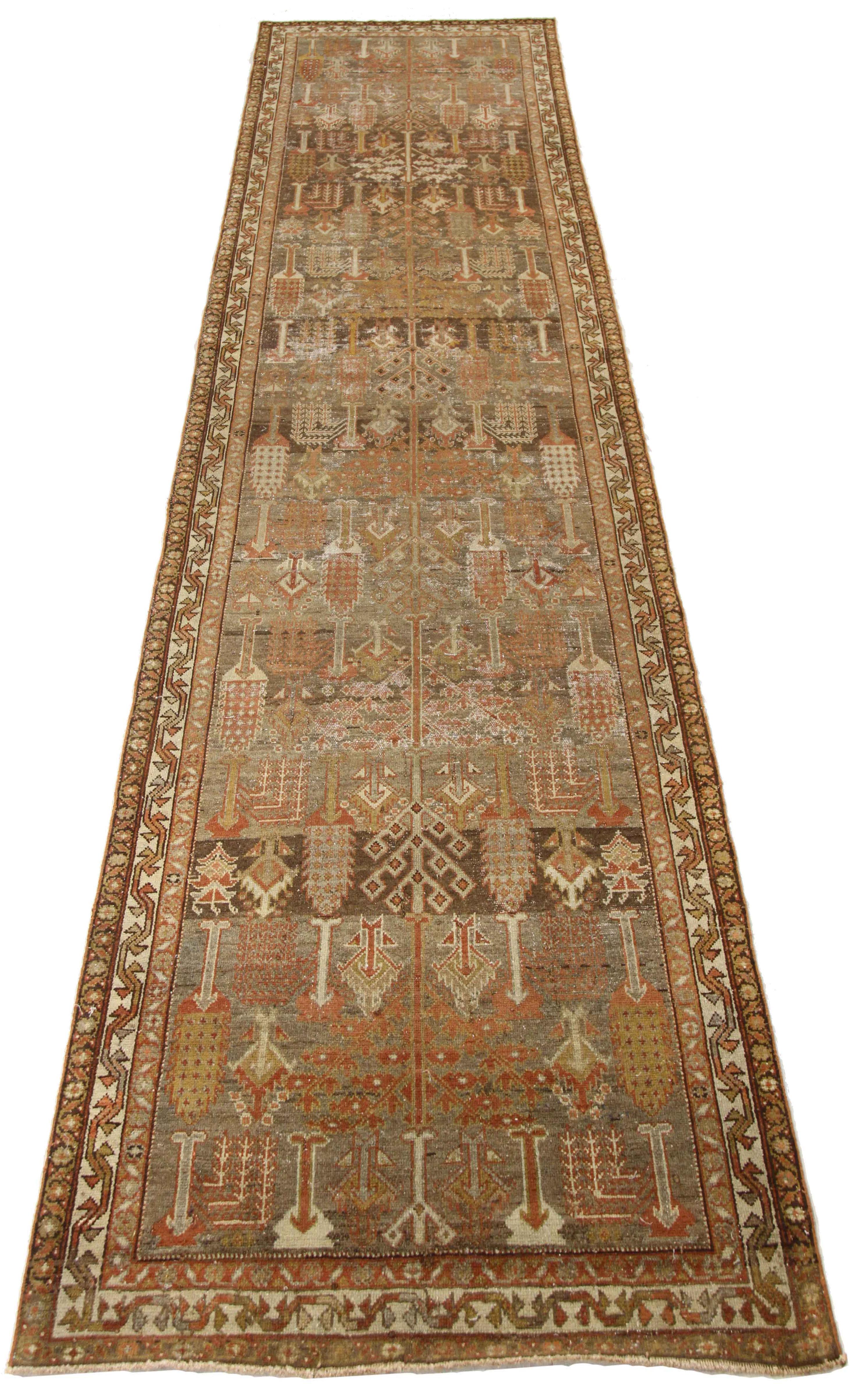 Antique Persian runner rug handwoven from the finest sheep’s wool. It’s colored with all-natural vegetable dyes that are safe for humans and pets. It’s a traditional Bakhtiar design handwoven by expert artisans. It’s a lovely runner rug that can be
