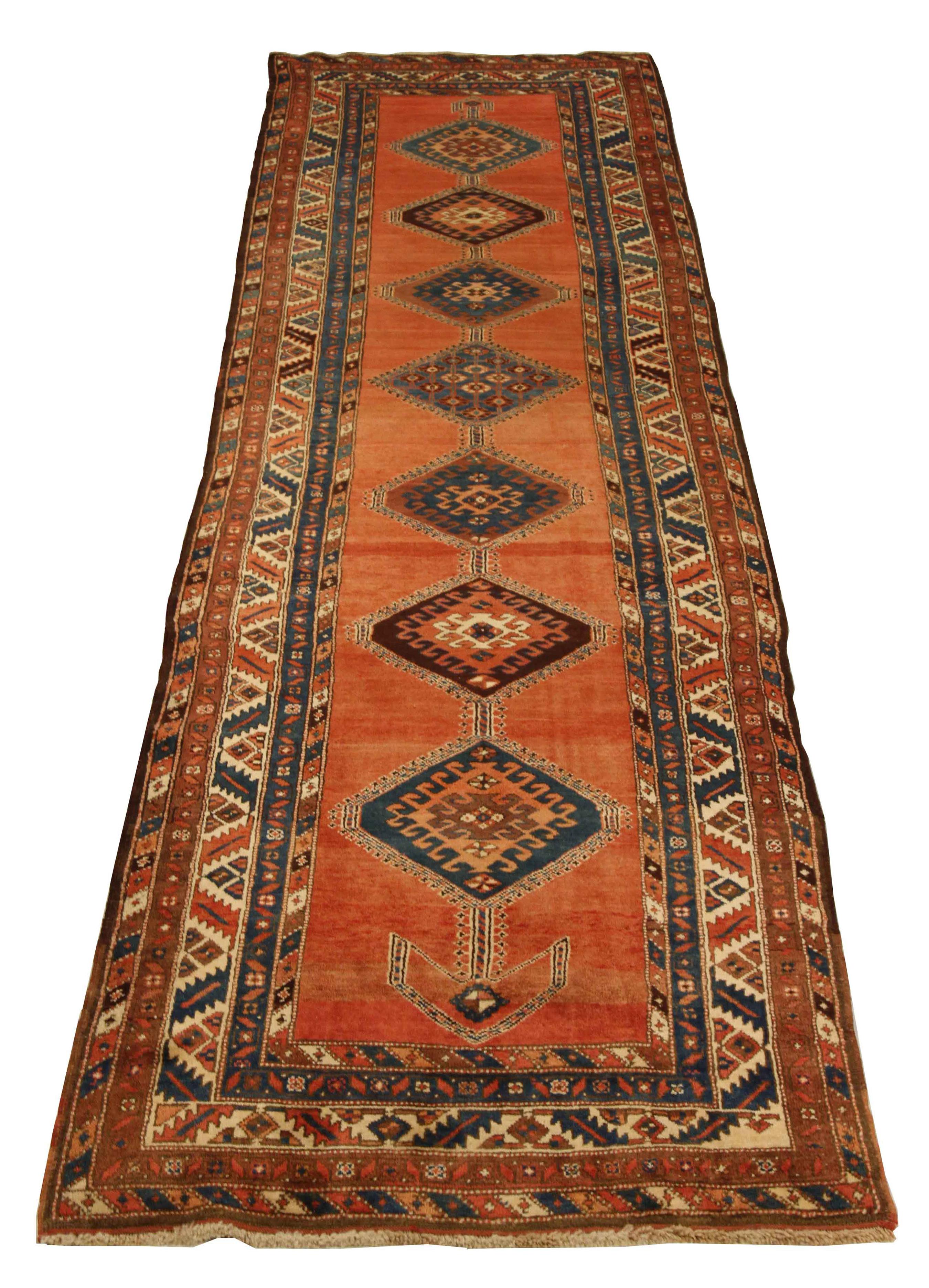 Antique Persian runner rug handwoven from the finest sheep’s wool. It’s colored with all-natural vegetable dyes that are safe for humans and pets. It’s a traditional Heriz design handwoven by expert artisans.It’s a lovely runner rug that can be