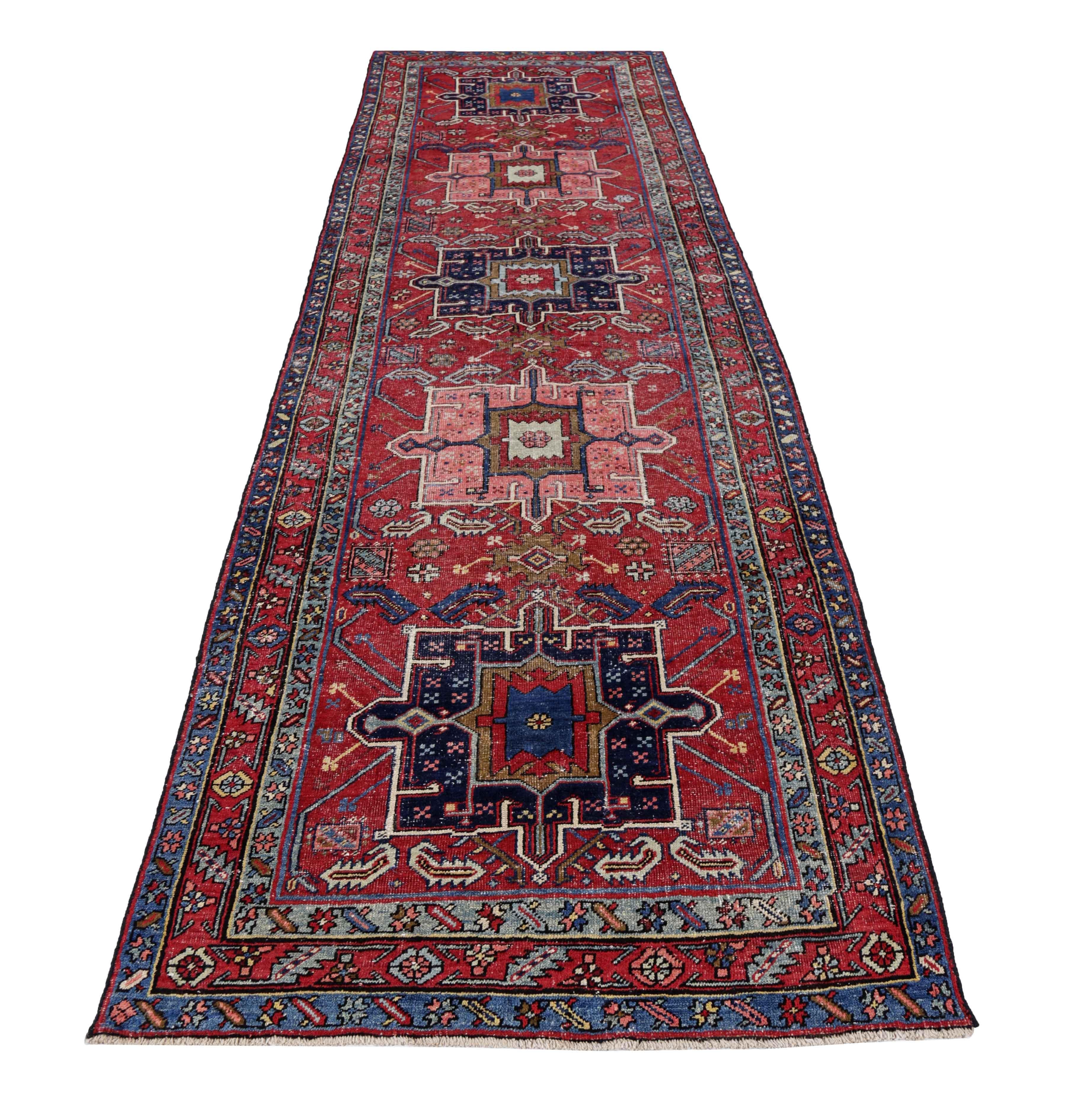 Antique Persian runner rug handwoven from the finest sheep’s wool. It’s colored with all-natural vegetable dyes that are safe for humans and pets. It’s a traditional Heriz design handwoven by expert artisans. It’s a lovely runner rug that can be