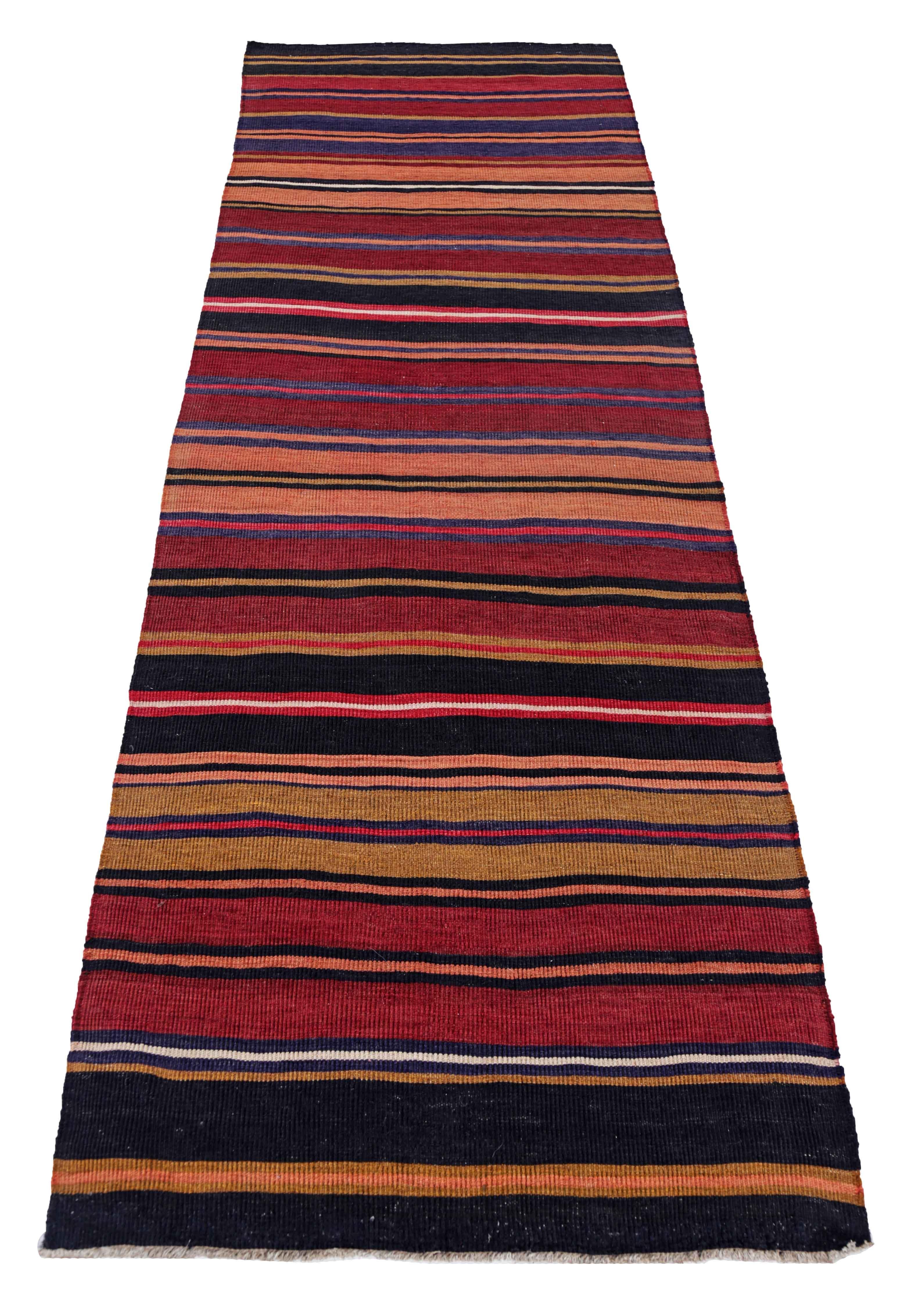 Antique Persian area rug handwoven from the finest sheep’s wool. It’s colored with all-natural vegetable dyes that are safe for humans and pets. It’s a traditional Kilim design handwoven by expert artisans. It’s a lovely runner rug that can be
