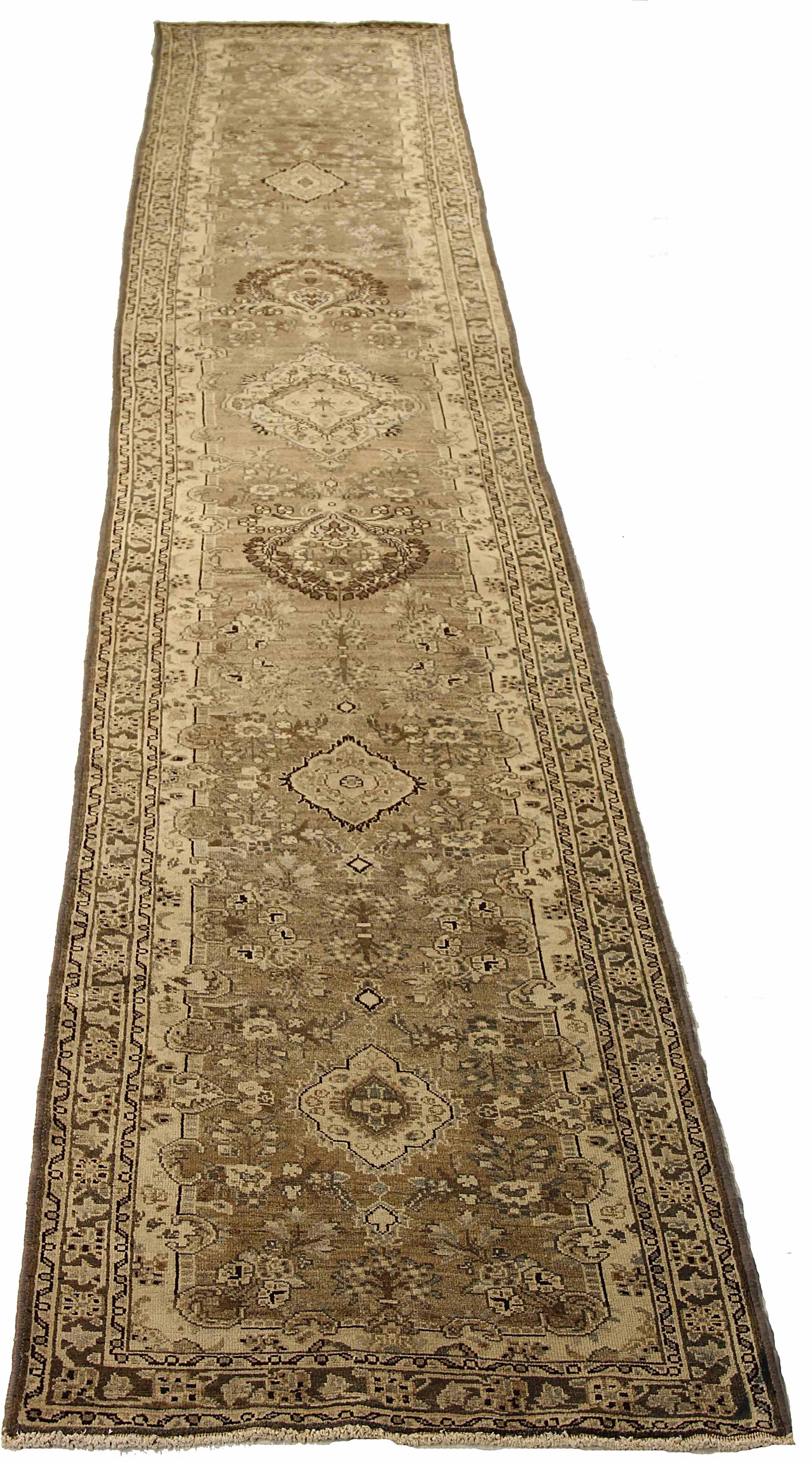 Antique Persian runner rug handwoven from the finest sheep’s wool. It’s colored with all-natural vegetable dyes that are safe for humans and pets. It’s a traditional Kolyai design handwoven by expert artisans. It’s a lovely runner rug that can be