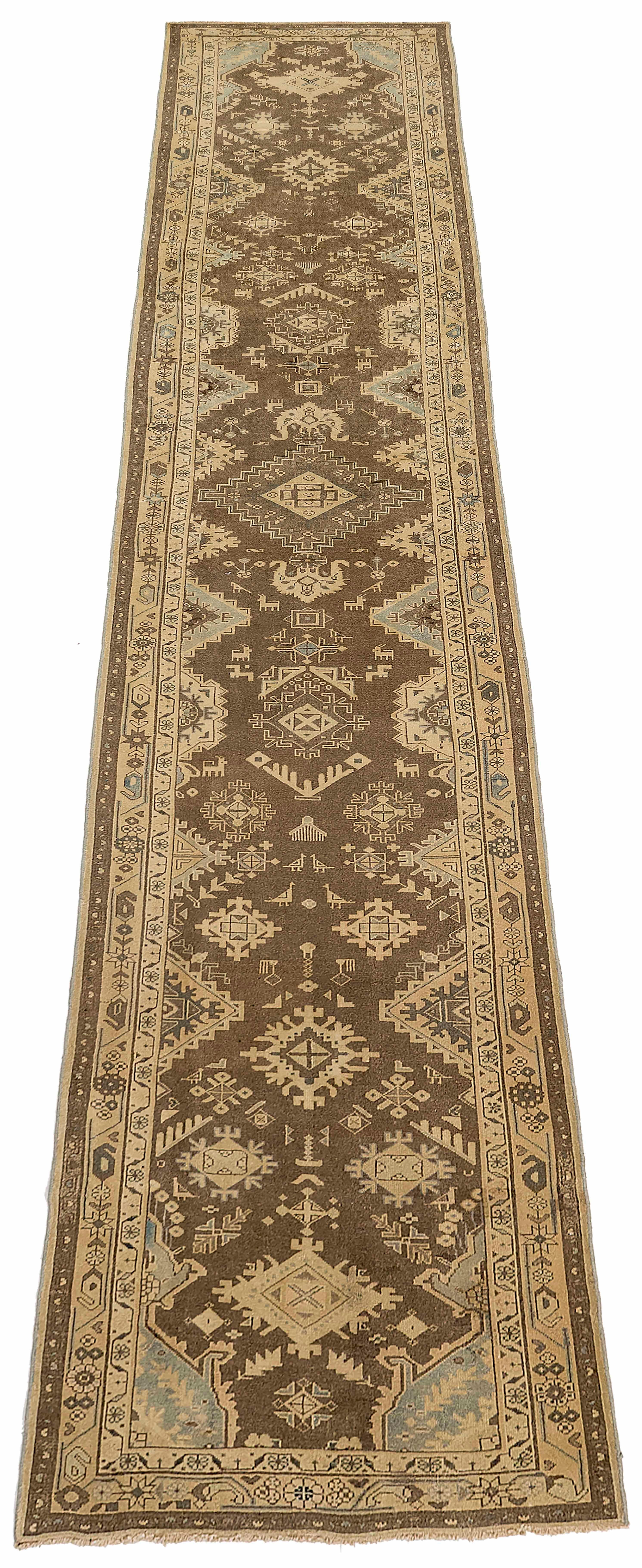 Antique Persian runner rug handwoven from the finest sheep’s wool. It’s colored with all-natural vegetable dyes that are safe for humans and pets. It’s a traditional Malayer design handwoven by expert artisans. It’s a lovely runner rug that can be