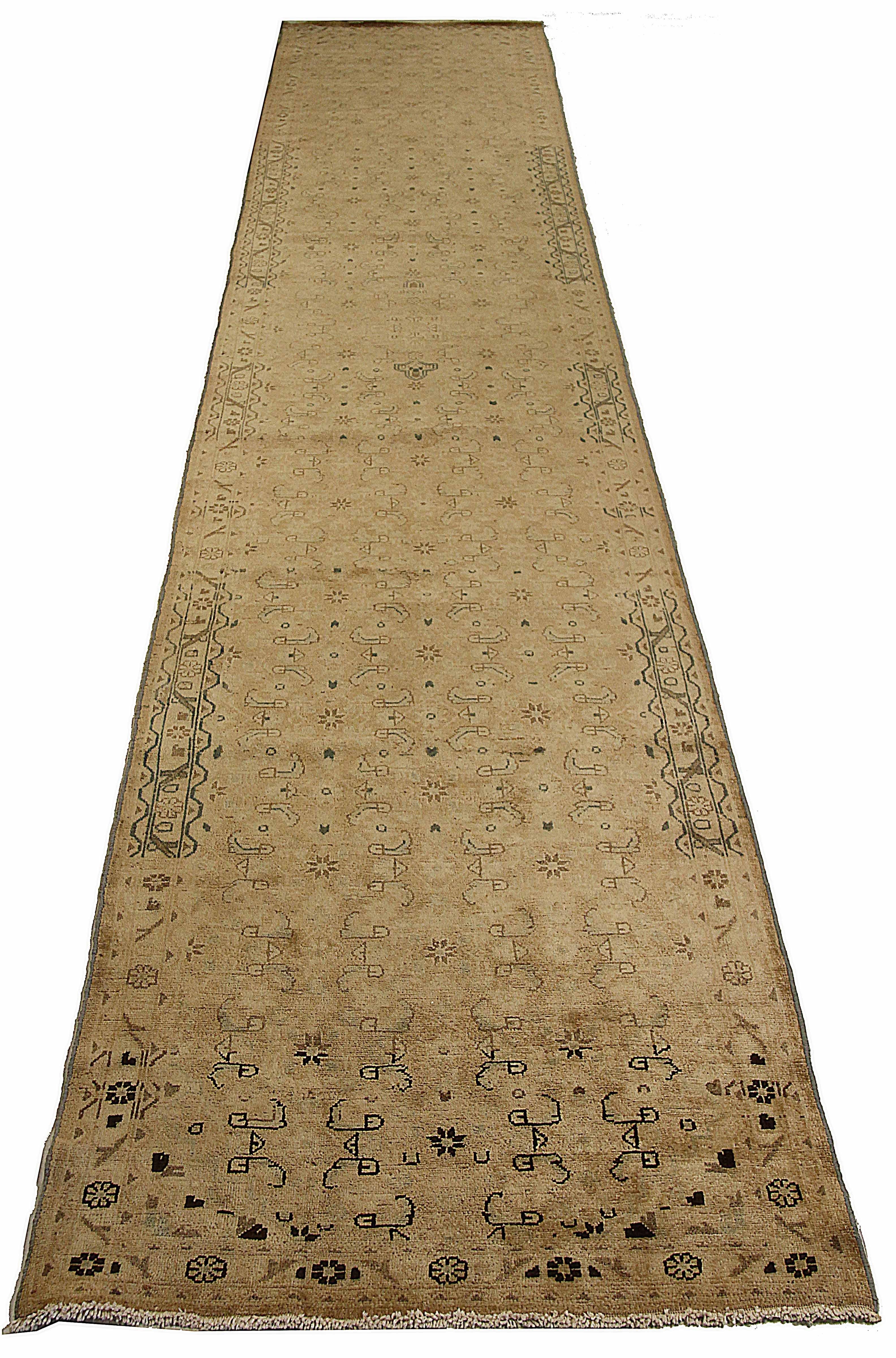 Antique Persian runner rug handwoven from the finest sheep’s wool. It’s colored with all-natural vegetable dyes that are safe for humans and pets. It’s a traditional Malayer design handwoven by expert artisans. It’s a lovely runner rug that can be