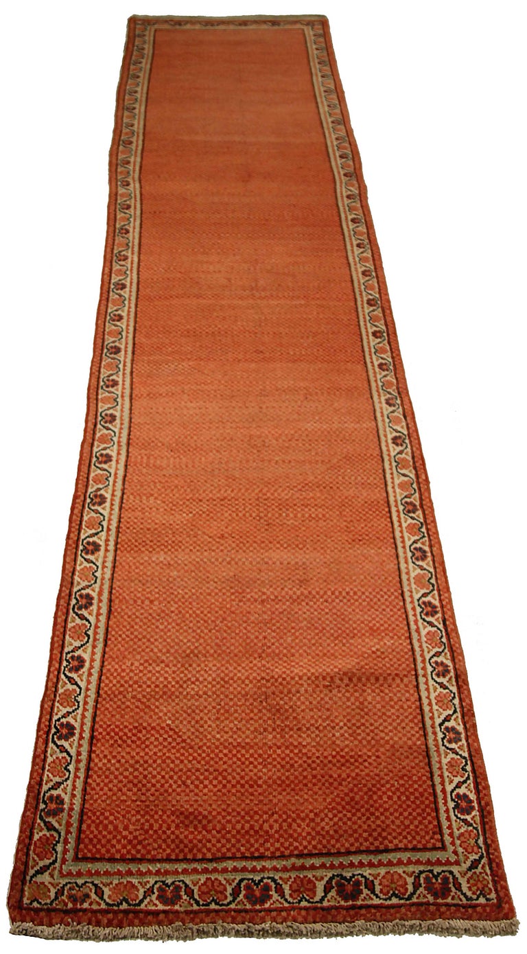 Antique Persian runner rug handwoven from the finest sheep’s wool. It’s colored with all-natural vegetable dyes that are safe for humans and pets. It’s a traditional Meshkabad design handwoven by expert artisans. It’s a lovely runner rug that can be
