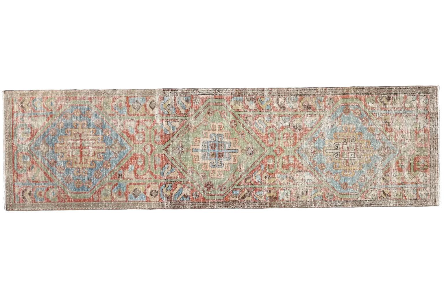 A Timeless Heirloom: The Antique Persian Sarab Runner Rug
Step into a world of timeless elegance with this magnificent Persian Sarab runner rug. Hand-woven in Iran, this rug is a testament to centuries of tradition and artistry, offering more than