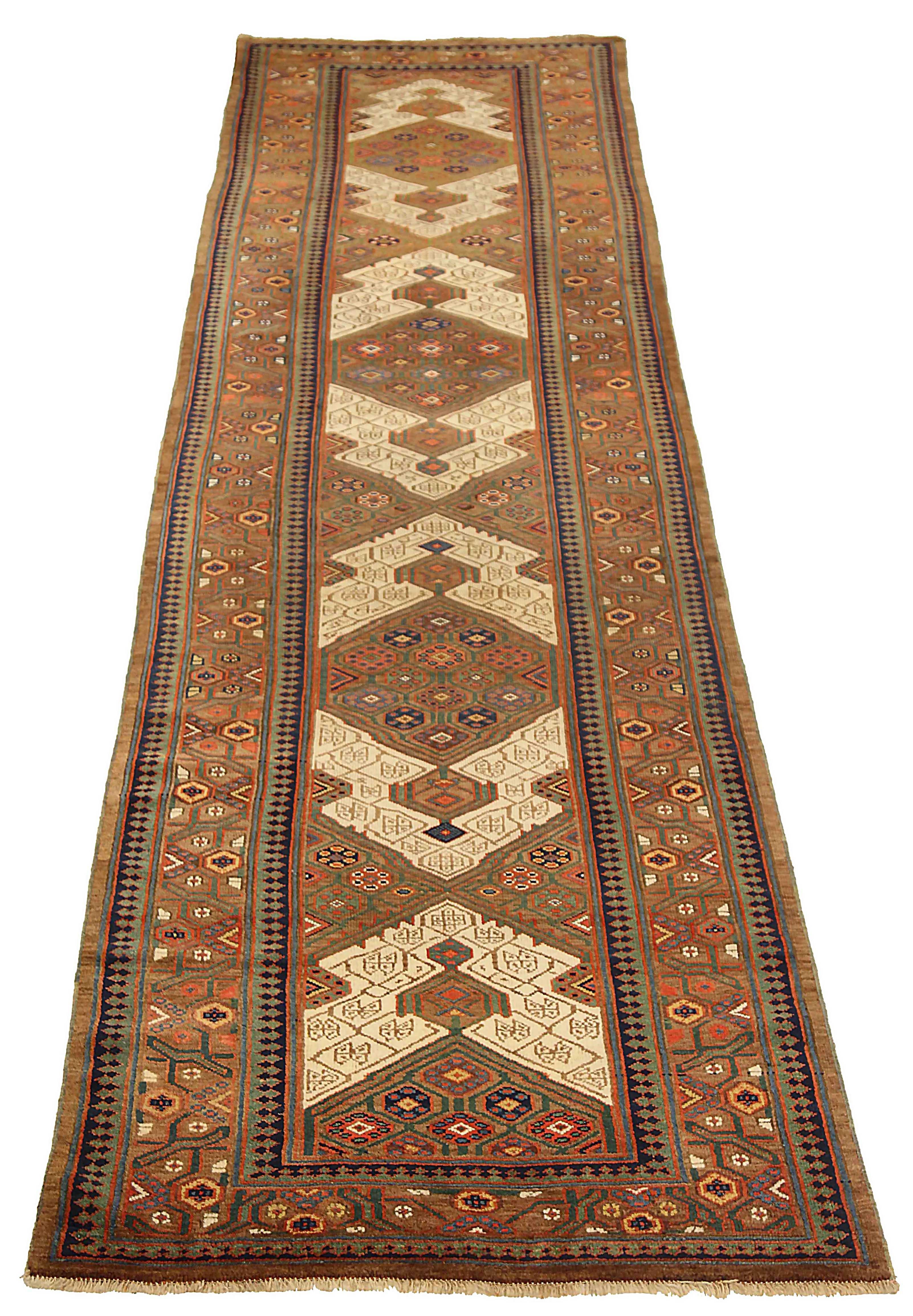 Antique Persian runner rug handwoven from the finest sheep’s wool. It’s colored with all-natural vegetable dyes that are safe for humans and pets. It’s a traditional Sarab design handwoven by expert artisans. It’s a lovely runner rug that can be