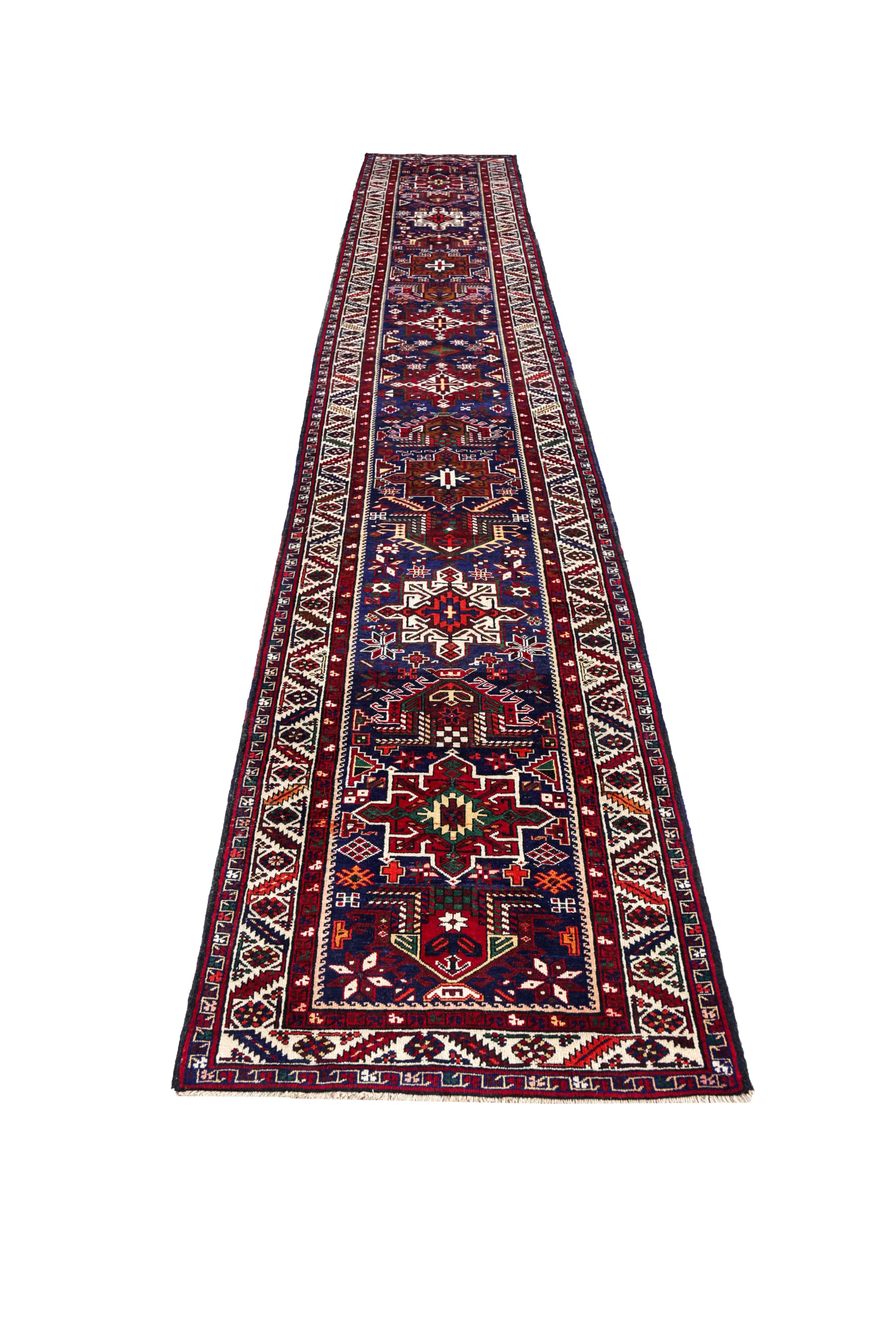 Antique Persian runner rug handwoven from the finest sheep’s wool. It’s colored with all-natural vegetable dyes that are safe for humans and pets. It’s a traditional Sarab design handwoven by expert artisans. It’s a lovely runner rug that can be
