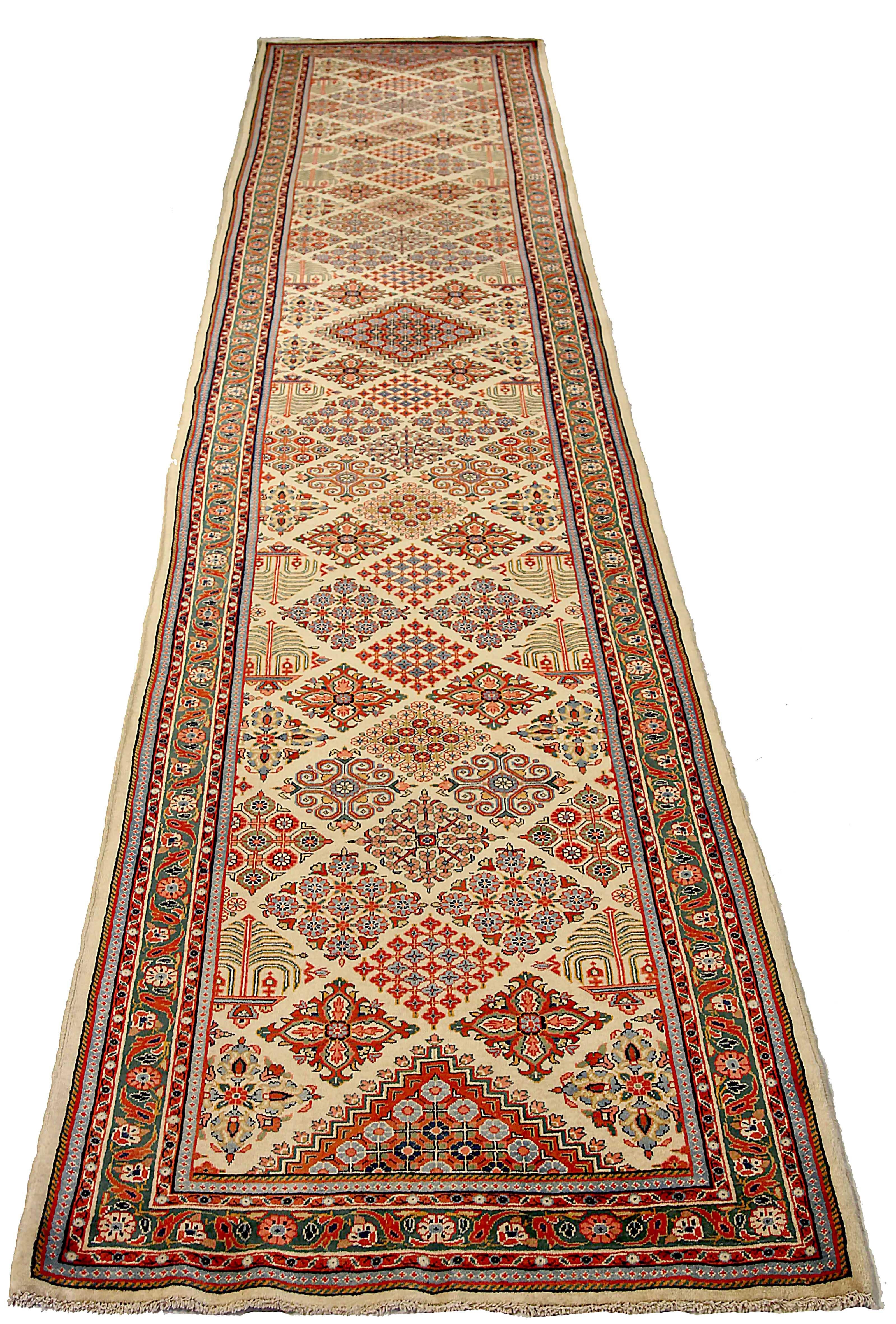 Antique Persian runner rug handwoven from the finest sheep’s wool. It’s colored with all-natural vegetable dyes that are safe for humans and pets. It’s a traditional Sarouk design handwoven by expert artisans. It’s a lovely runner rug that can be