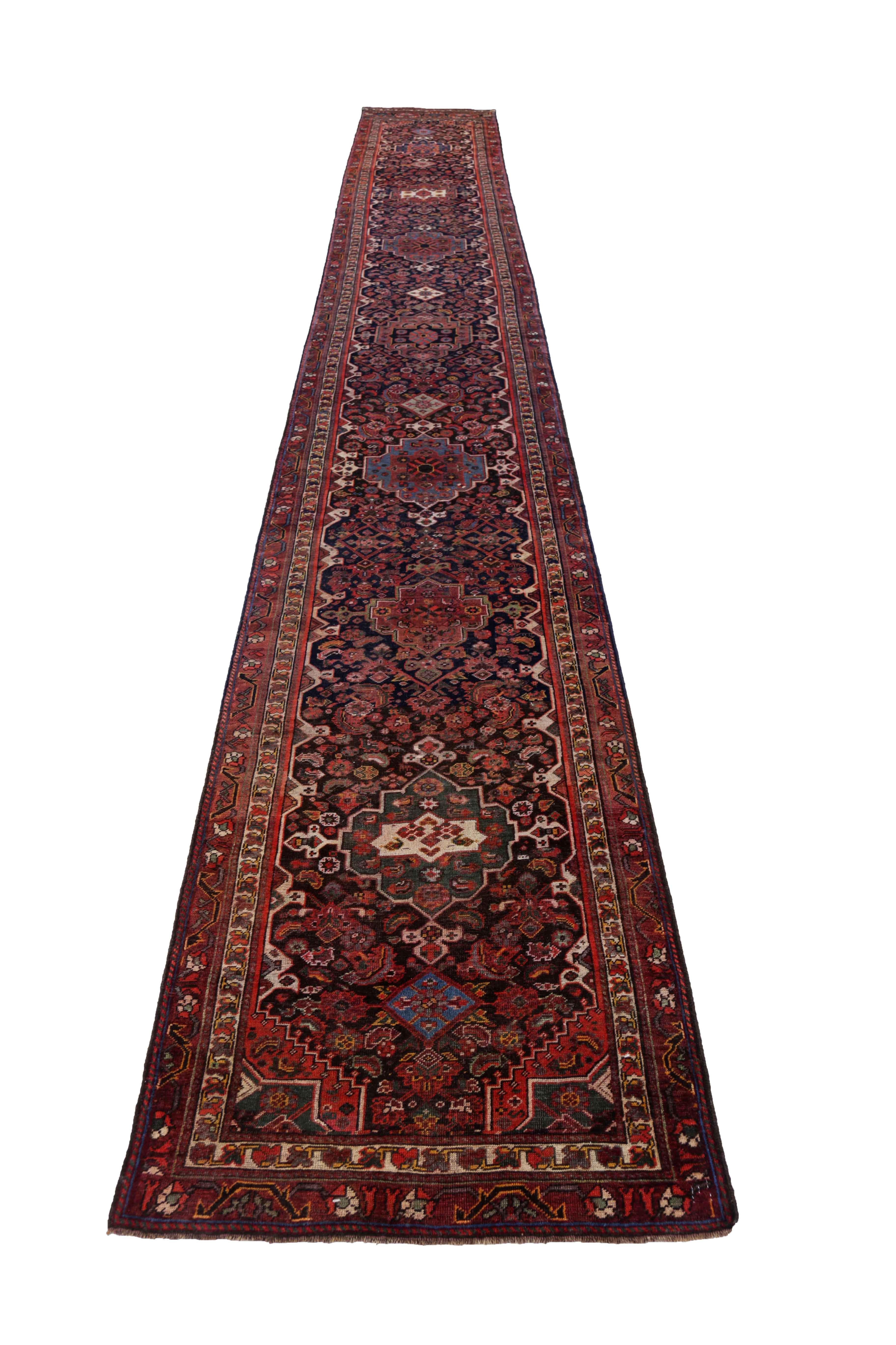 Antique Persian runner rug handwoven from the finest sheep’s wool. It’s colored with all-natural vegetable dyes that are safe for humans and pets. It’s a traditional Shiraz design handwoven by expert artisans. It’s a lovely runner rug that can be