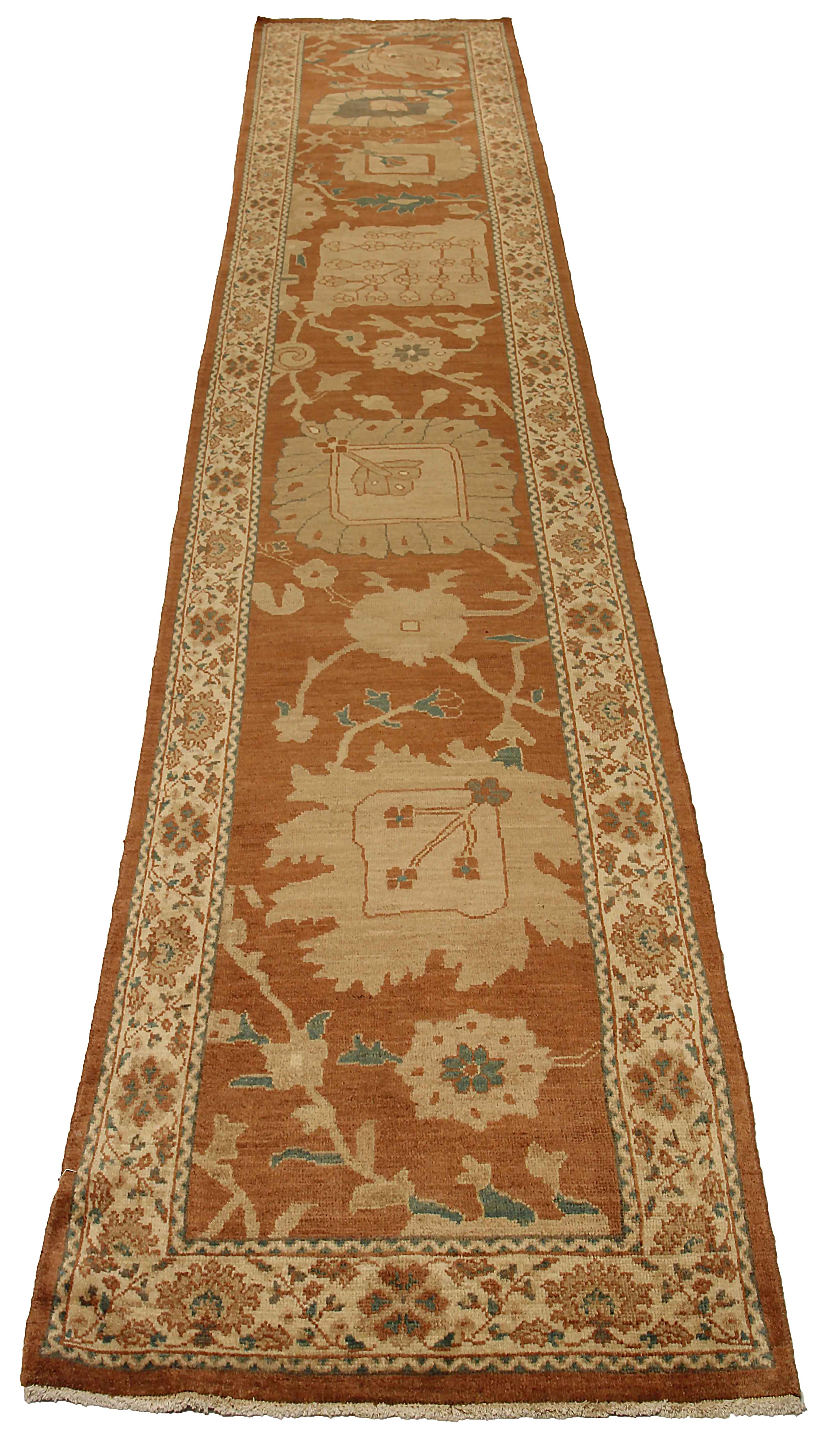 Antique handmade Turkish runner rug from high quality sheep’s wool and colored with eco-friendly vegetable dyes that are proven safe for humans and pets alike. It’s a classic Sultanabad design showcasing a regal brown field with prominent Herati