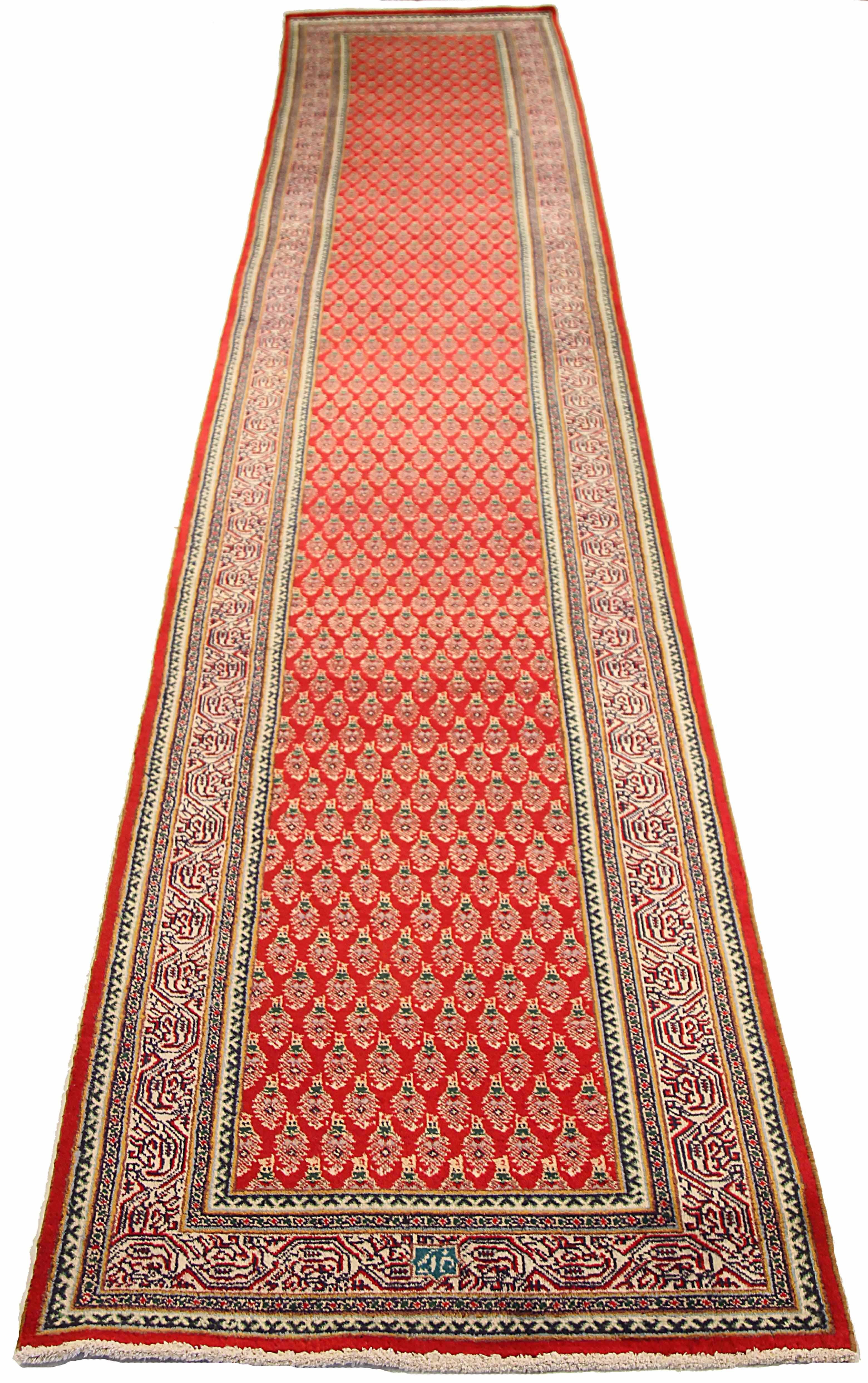 Antique Persian runner rug handwoven from the finest sheep’s wool. It’s colored with all-natural vegetable dyes that are safe for humans and pets. It’s a traditional Tabriz design handwoven by expert artisans. It’s a lovely runner rug that can be