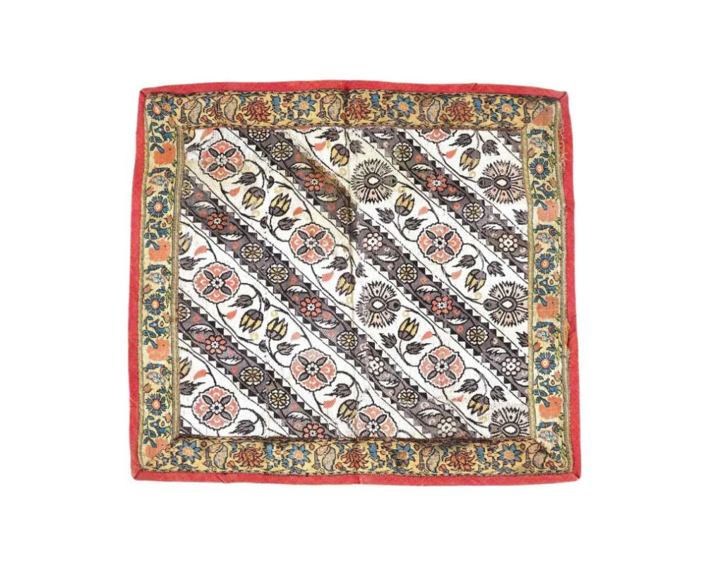 An antique Persian Iranian Safavid dynasty hand woven embroidered textile. The textile is decorated with hand woven floral and foliage motifs on the front side and floral medallions on the reverse side. Circa: 17th century. The Safavid dynasty,