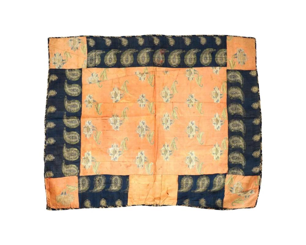 An antique Persian Iranian Safavid dynasty hand woven textile blanket. The textile decorated with flowers and paisley ornaments. The reverse side is covered with orange colored linen. Safavid Iran or Safavid Persia, also referred to as the Safavid