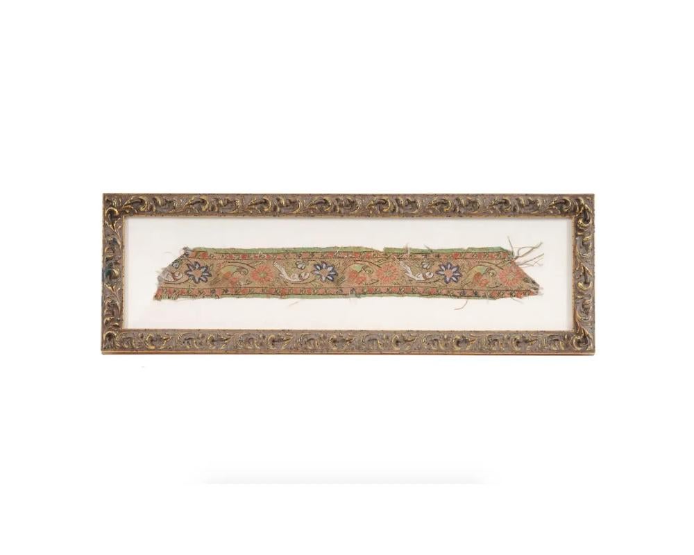 An antique Persian fragment of textile tapestry. Late Safavid dynasty, 18th century. Parrot birds and flowers pattern. Canvas mat, golden frame. Collectible Furnishing And Textiles, Oriental Islamic Folk Arts And Applied Arts,