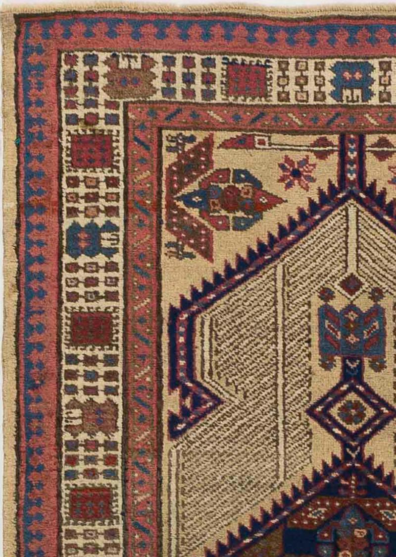 Antique Persian runner rug handwoven from the finest sheep’s wool and colored with all-natural vegetable dyes that are safe for humans and pets. It’s a traditional Sarab design featuring geometric details in navy blue and brown over an ivory and