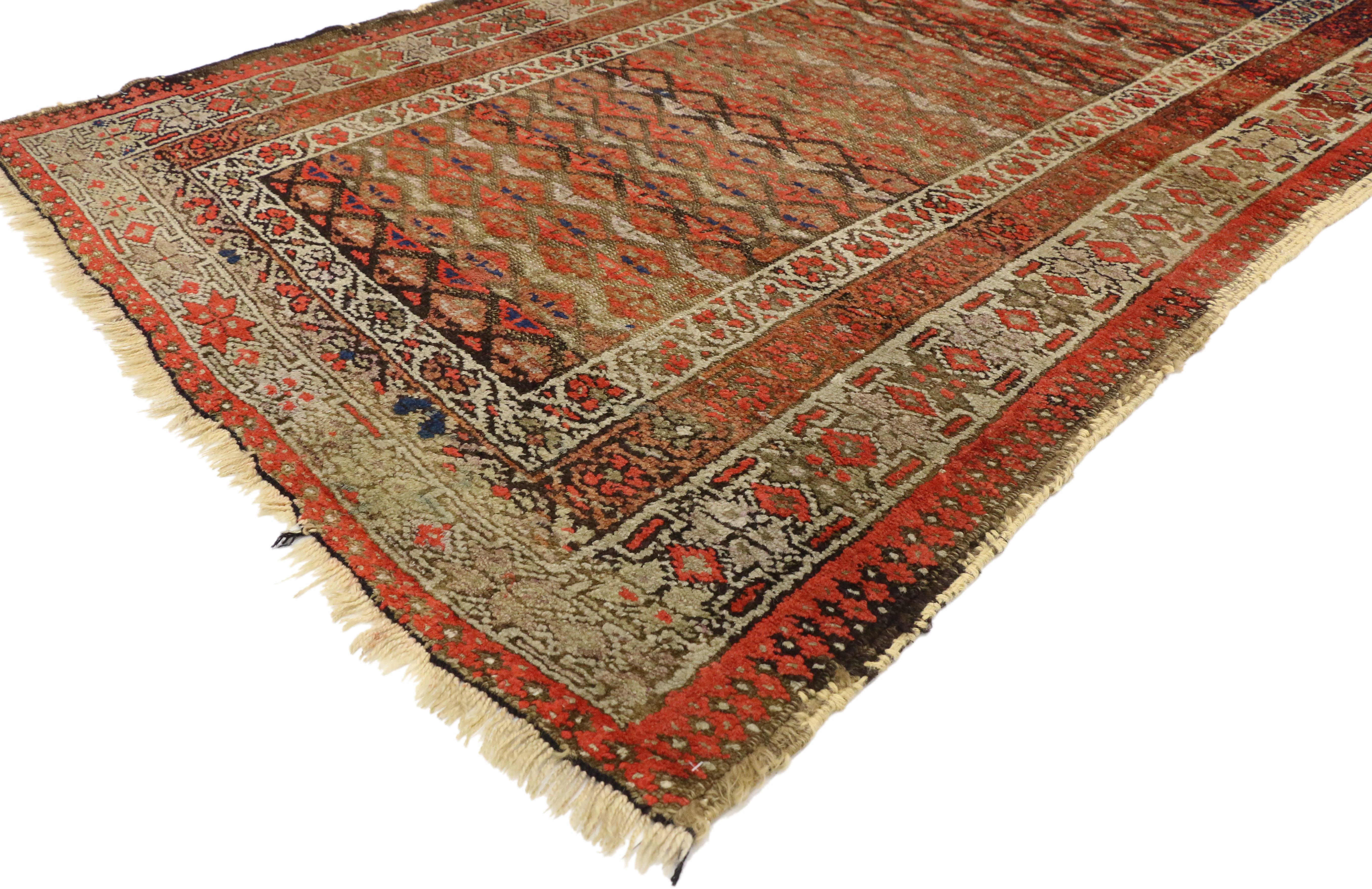 70981 Antique Persian Sarab Rug with Rustic Artisan Style 03'08 x 06'01. This hand-knotted Antique Persian Sarab Rug features an all-over geometric pattern composed of boteh motifs in bright orange red against a variegated abrash backdrop in sand