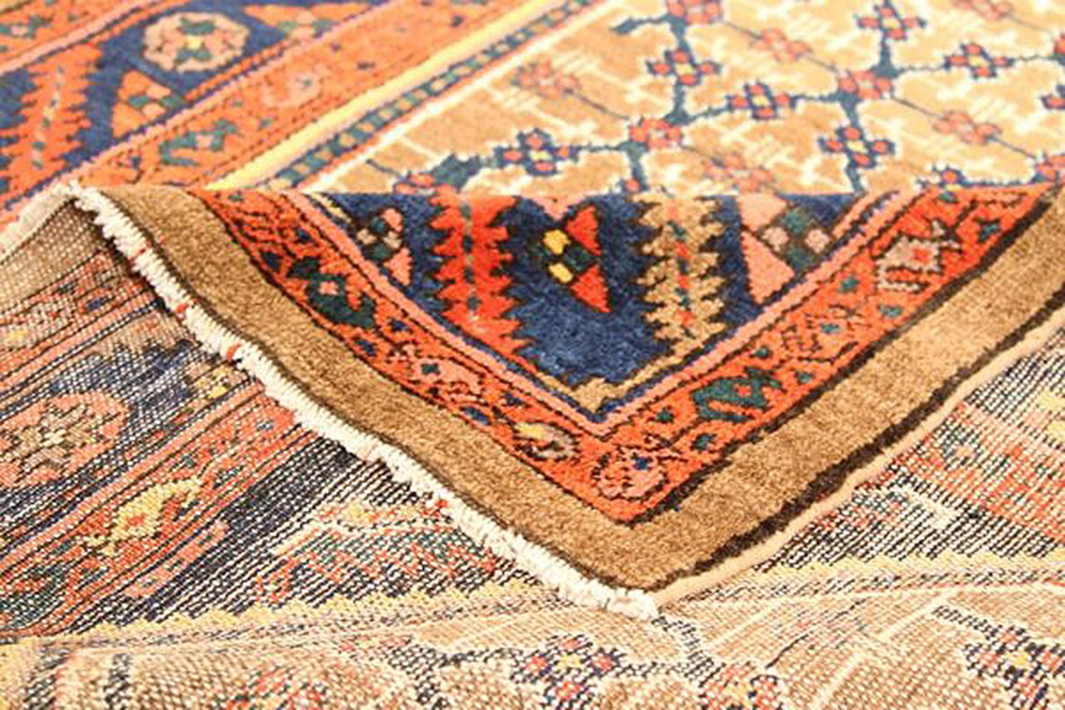 Islamic Antique Persian Sarab Runner Rug with Navy and Brown Floral Details For Sale