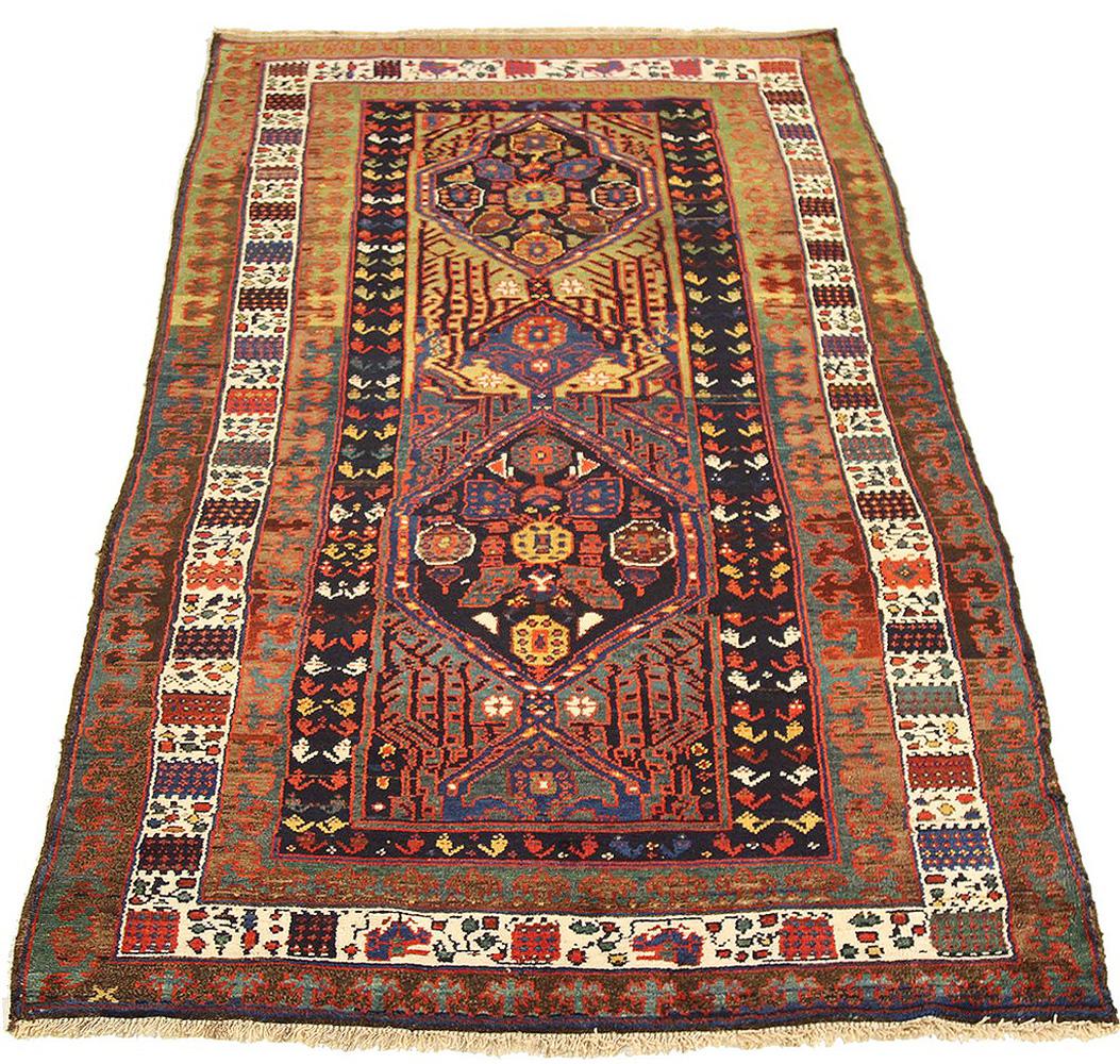 Antique Persian runner rug handwoven from the finest sheep’s wool and colored with all-natural vegetable dyes that are safe for humans and pets. It’s a traditional Sarab design featuring floral details in red, blue, green, and black over a beige and