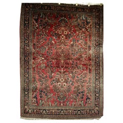 Tappeto antico persiano Sarouk con motivo floreale in rosso, avorio e verde