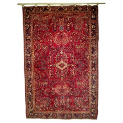 Tappeto antico persiano Sarouk con motivi floreali in rosso, avorio e blu
