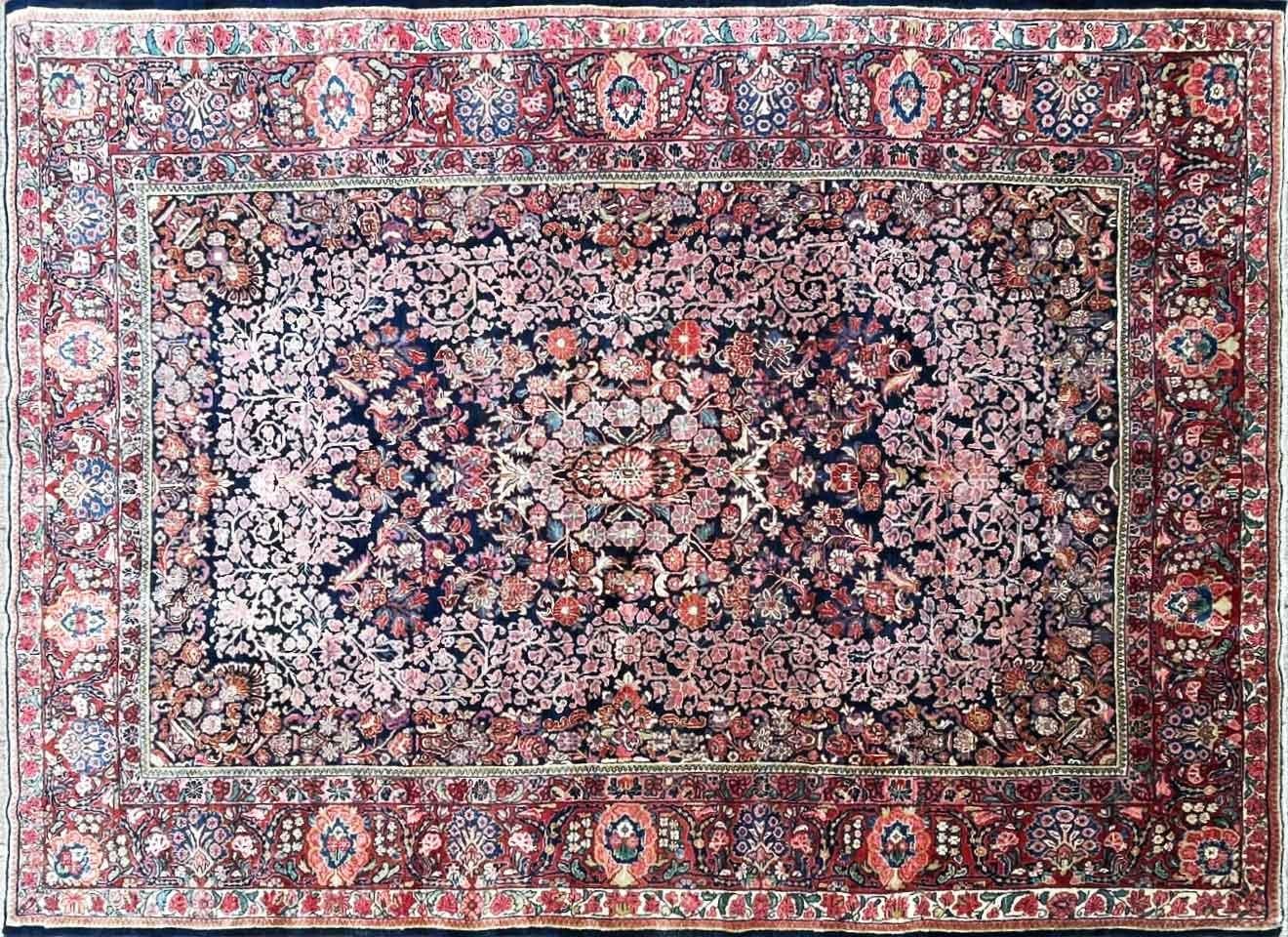 Step into a world of timeless elegance with our captivating Antique Persian Sarouk Carpet, a splendid wedding rug from Northwest Persia. This masterpiece, measuring a generous 8'9