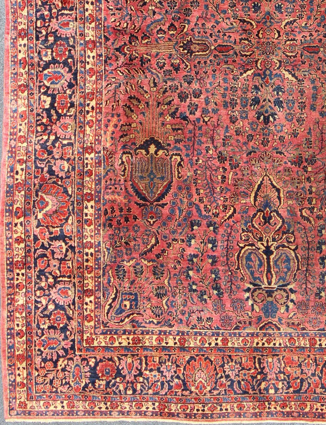 Antique Persian Sarouk Carpet with Deep Cranberry Field and Floral Elements, S12--0608, 1920's Antique Sarouk Rug.This wonderful, early 20th century Persian Sarouk rug features a masterfully woven deep cranberry field of large trees and a myriad of
