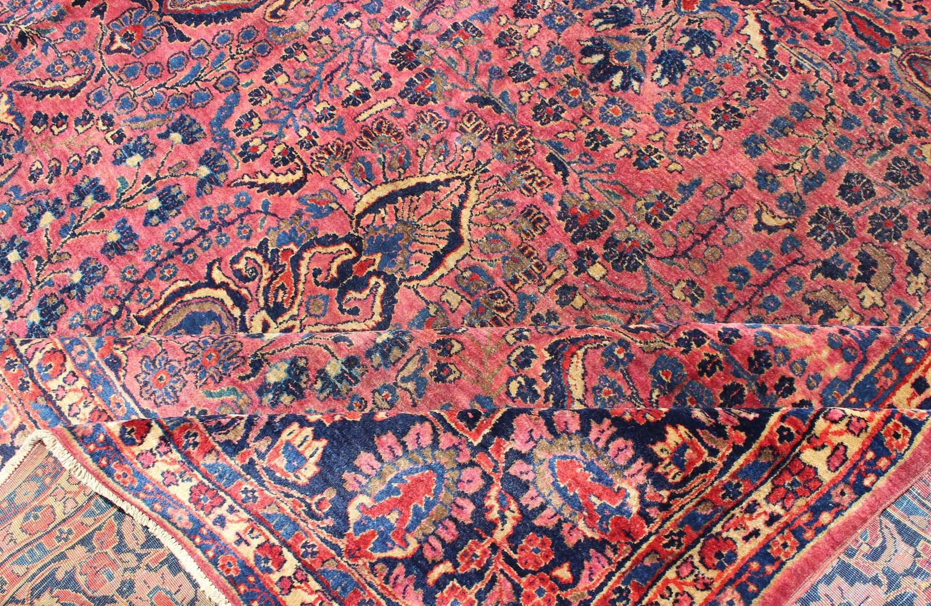 Antique Persian Sarouk Carpet with Deep Cranberry Field and Floral Elements In Good Condition In Atlanta, GA
