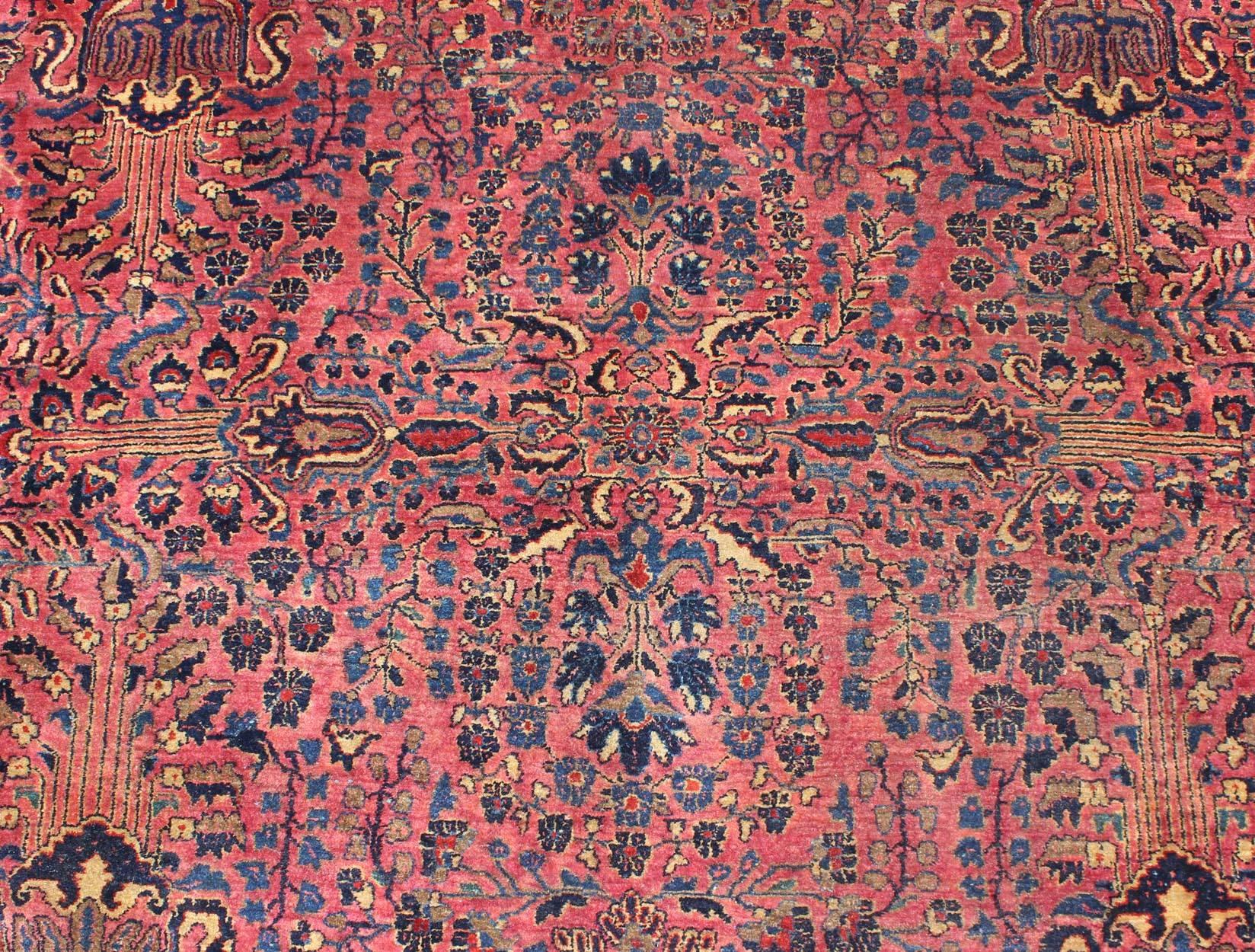 20th Century Antique Persian Sarouk Carpet with Deep Cranberry Field and Floral Elements