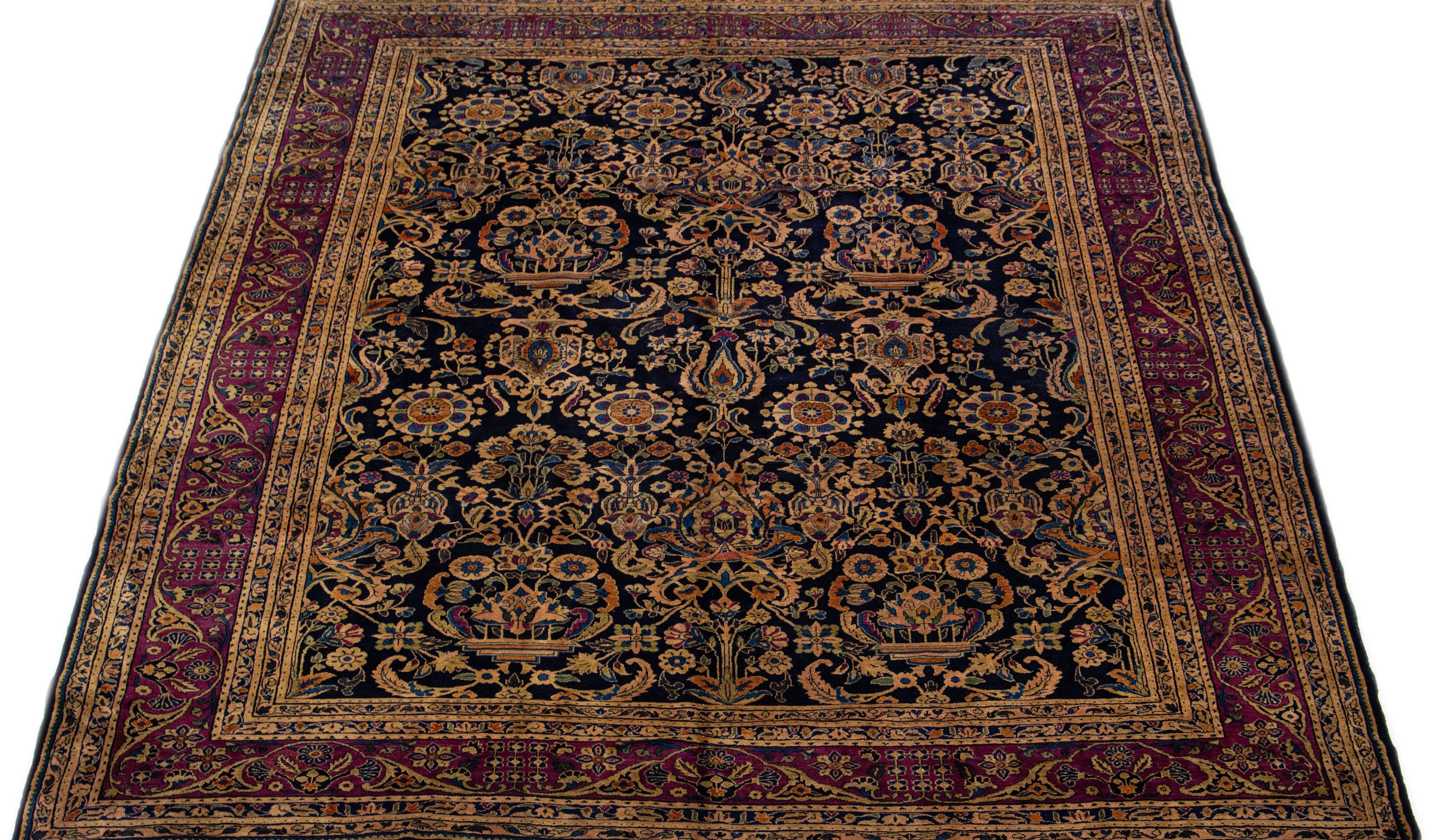Beautiful Antique Farahan hand-knotted wool rug with a dark blue field. This Persian rug has a purple-designed frame with multi-color accents on a Classic floral design.

This rug measure: 9'2