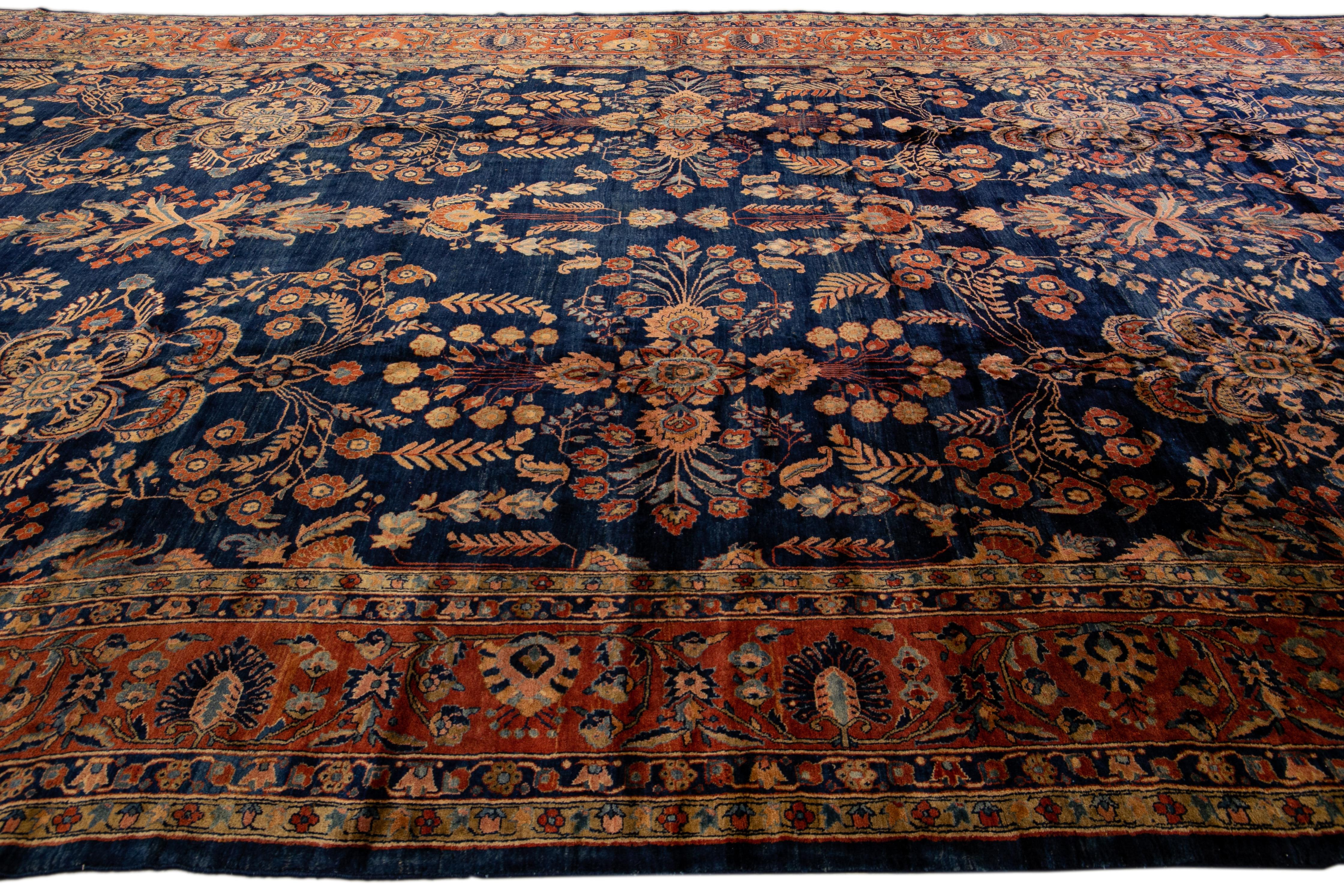 20th Century Antique Persian Sarouk Farahan Handmade Floral Motif Oversize Navy Blue Wool Rug For Sale