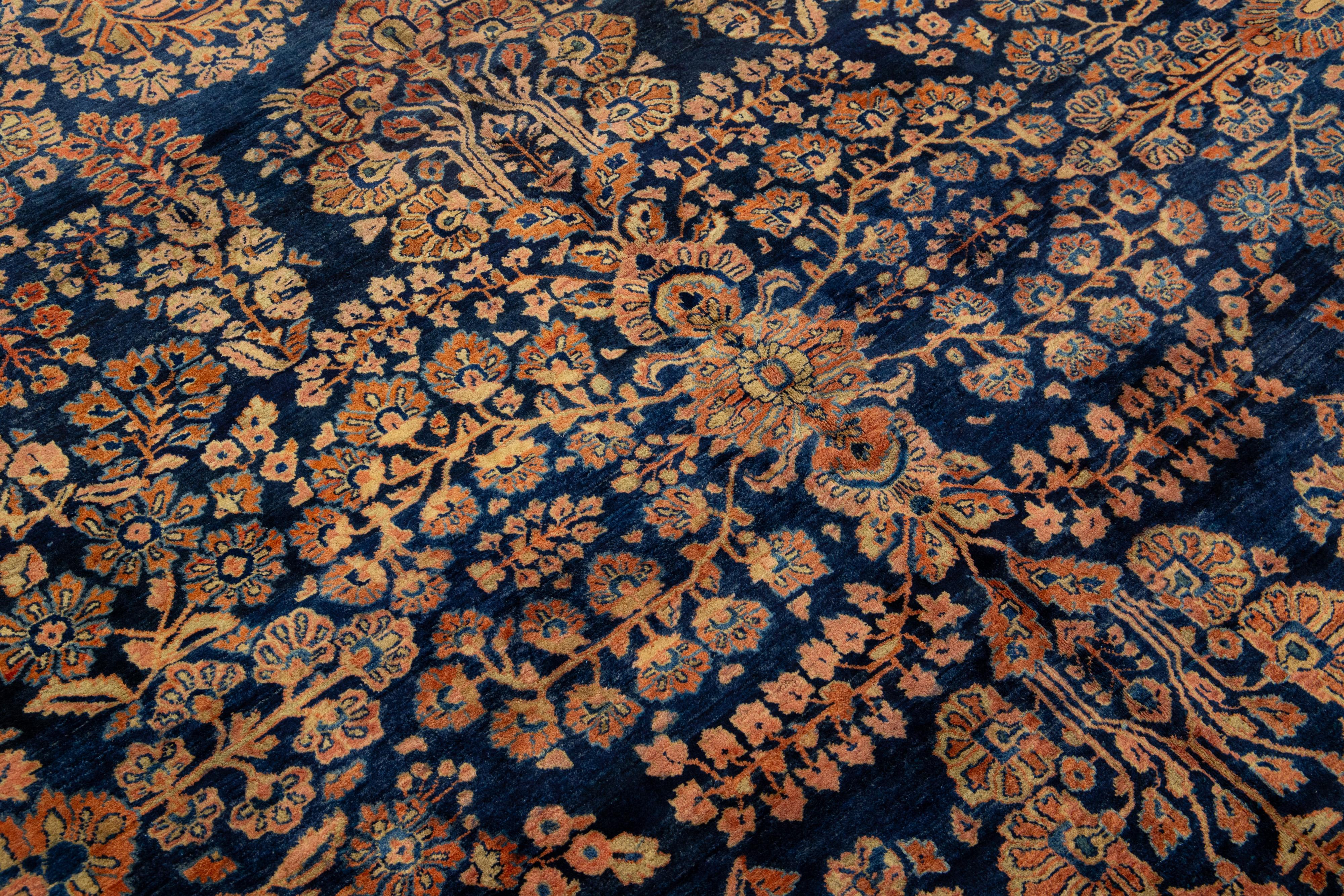 Antique Persian Sarouk Farahan Handmade Floral Motif Wool Rug In Navy Blue For Sale 1