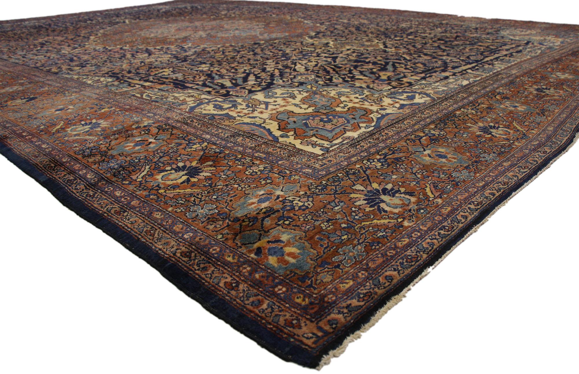 77179 antique Persian Sarouk Farahan rug, Persian palace size rug. Showcasing luxurious opulence and traditional style this hand knotted wool antique Persian Sarouk Farahan rug is a vision of Classic beauty. At the center, a large oval medallion