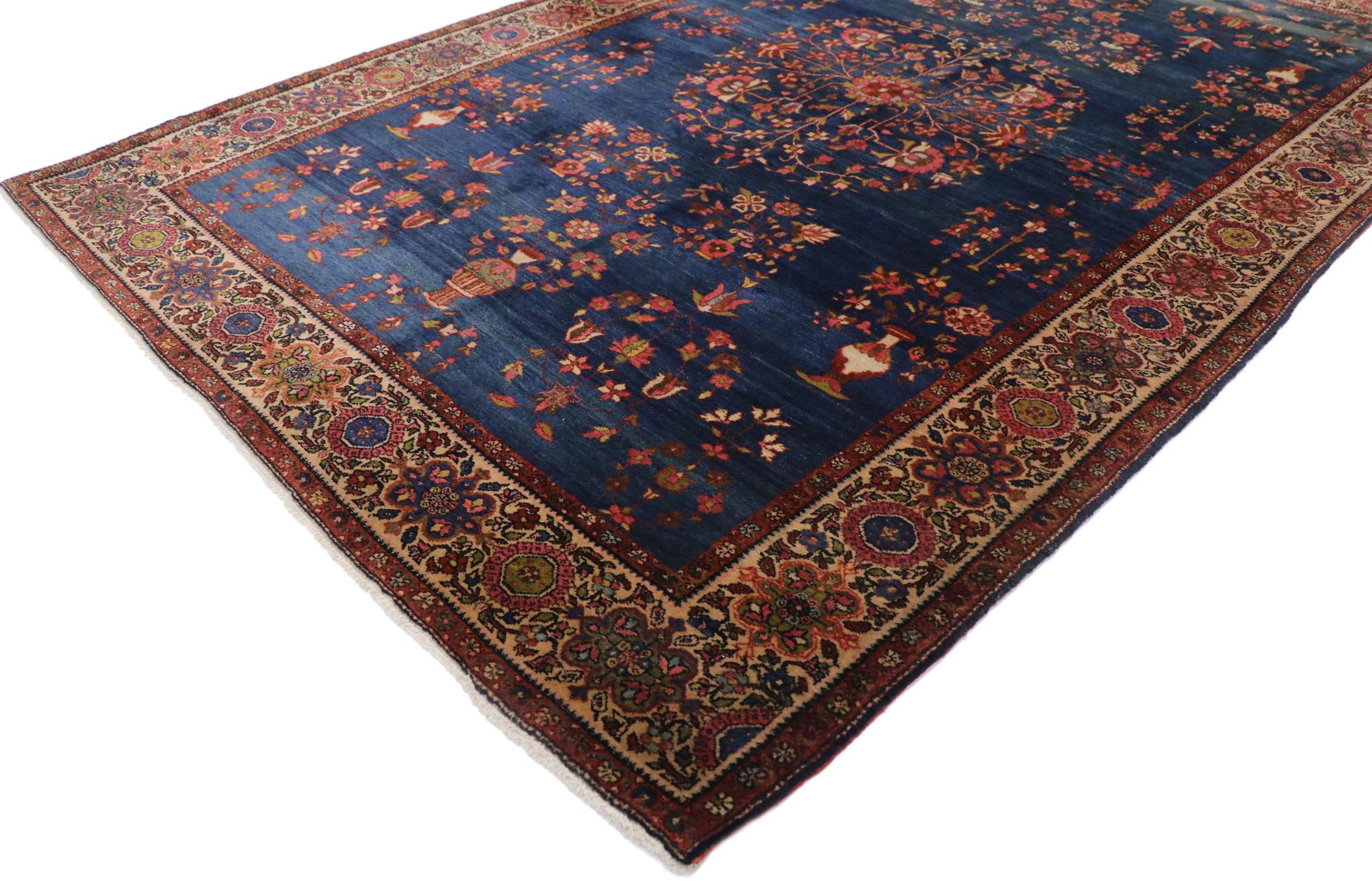 77799 Antique Persian Sarouk Farahan rug with Victorian style 04'03 x 06'06. With its beguiling beauty and rich jewel-tones, this hand-knotted wool antique Persian Sarouk rug is poised to impress. The abrashed navy blue field features an open floral