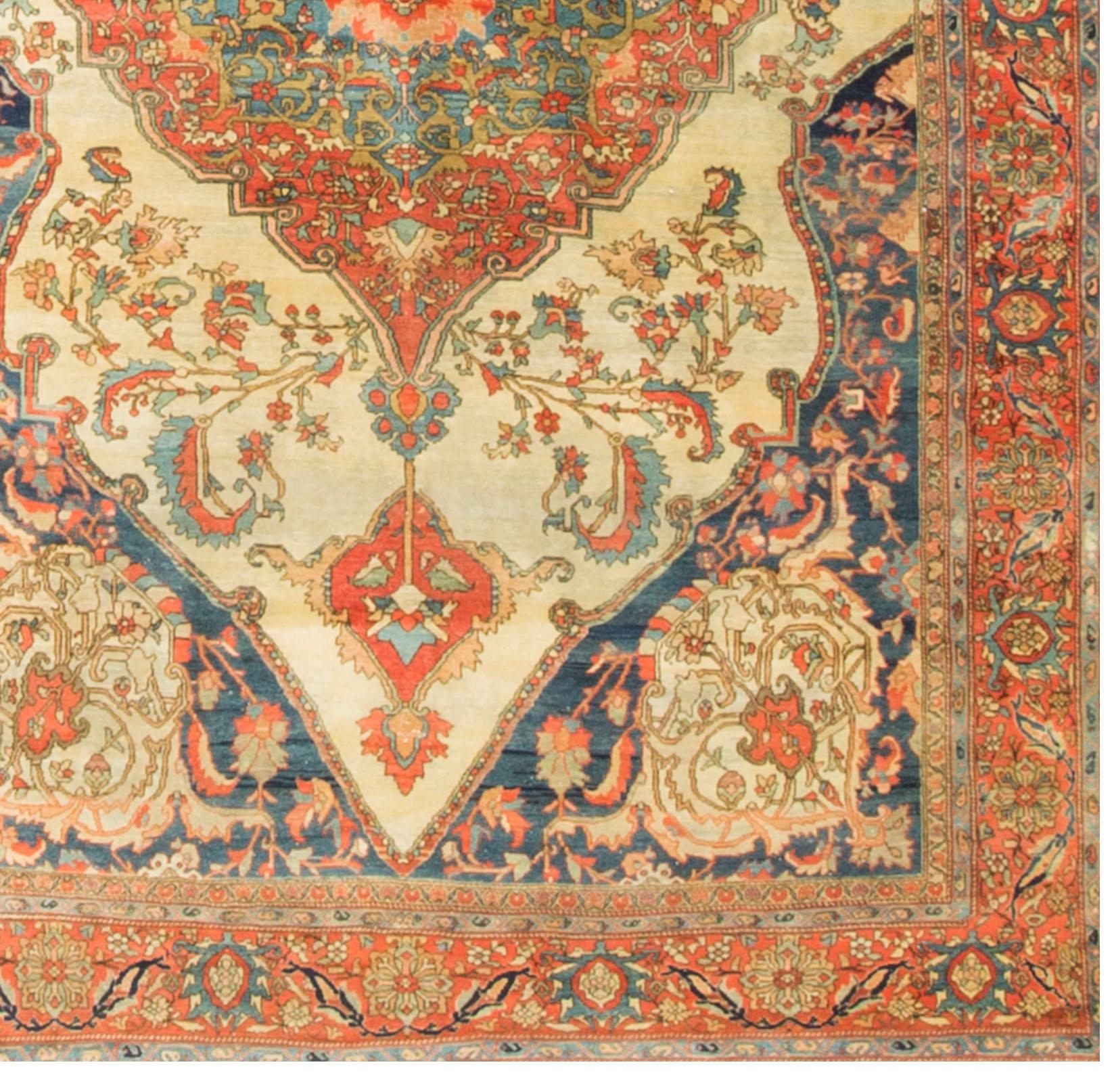 Antique Persian Sarouk Feraghan rug carpet, circa 1900. A stunning antique circa 1900 Sarouk Feraghan rug. The central medallions ever increasing in size and finally enclosed in a blue ground with four glorious floral spandrels to create a powerful