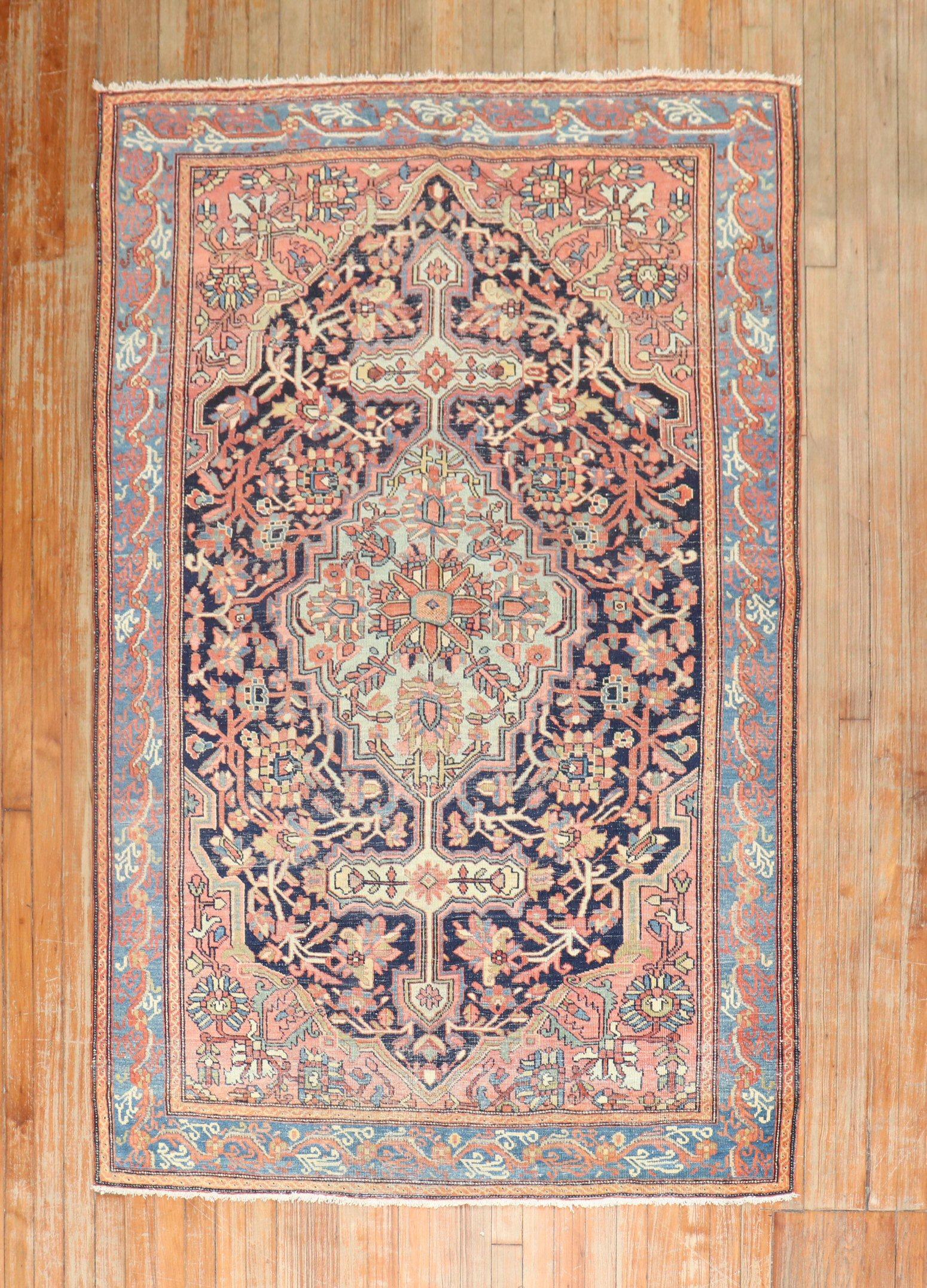 An authentic Persian Sarouk Farahan rug from the 2nd quarter of the 20th century with a traditional medallion border design

Measures: 4'4'' x 6'10''