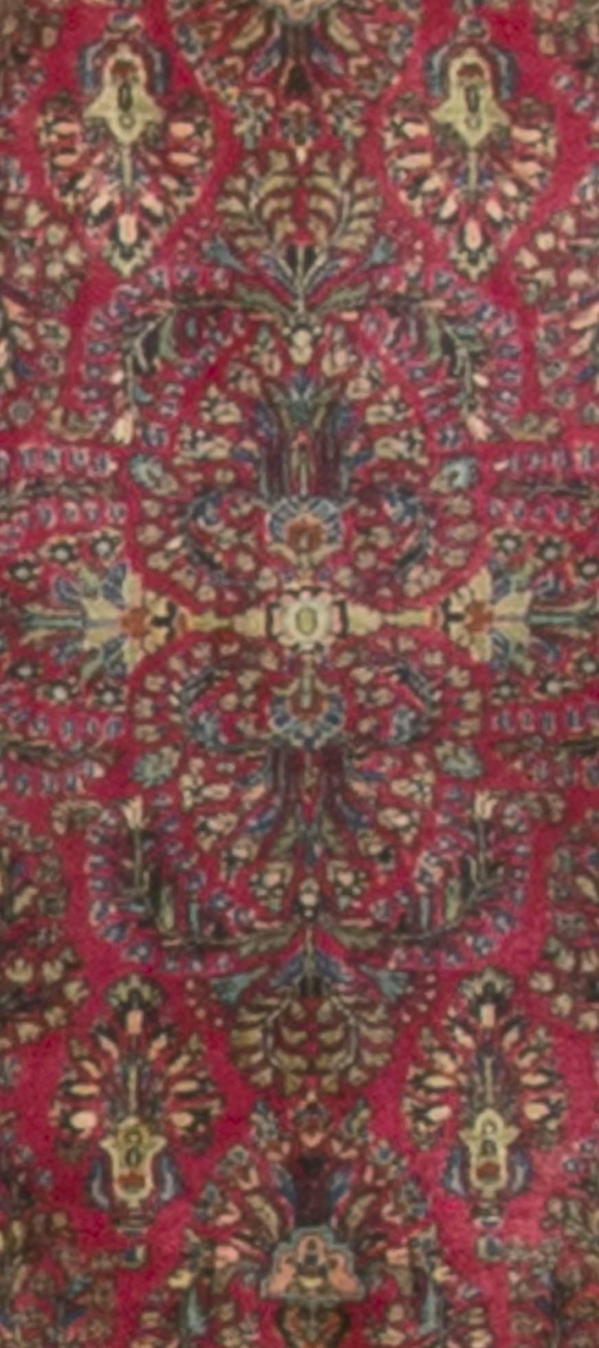 A small Persian Sarouk rug, circa 1900. Size: 2'2 x 4'