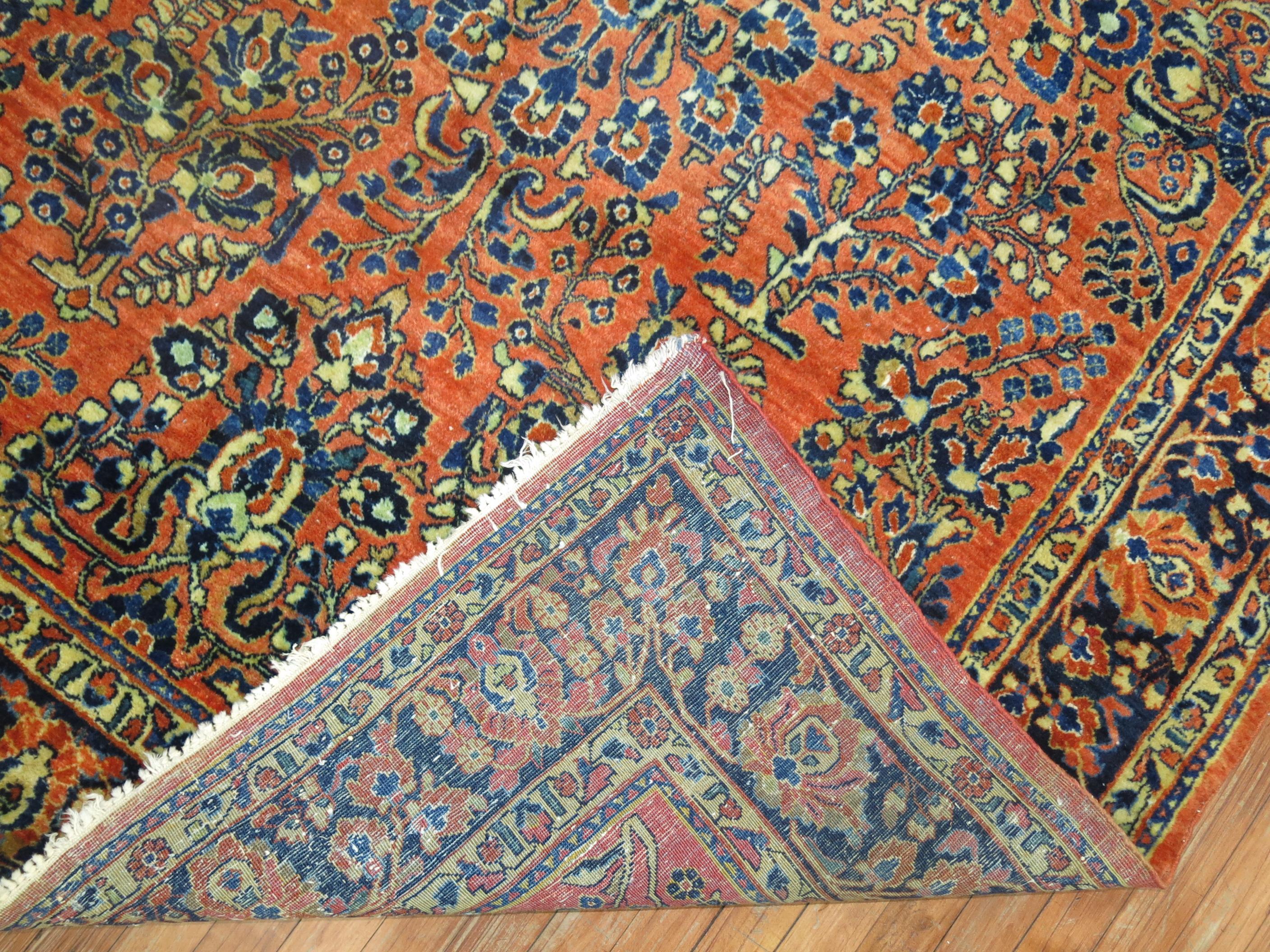 An early 20th century rare size Persian Sarouk rug.

Measures: 6' x 8'11''.