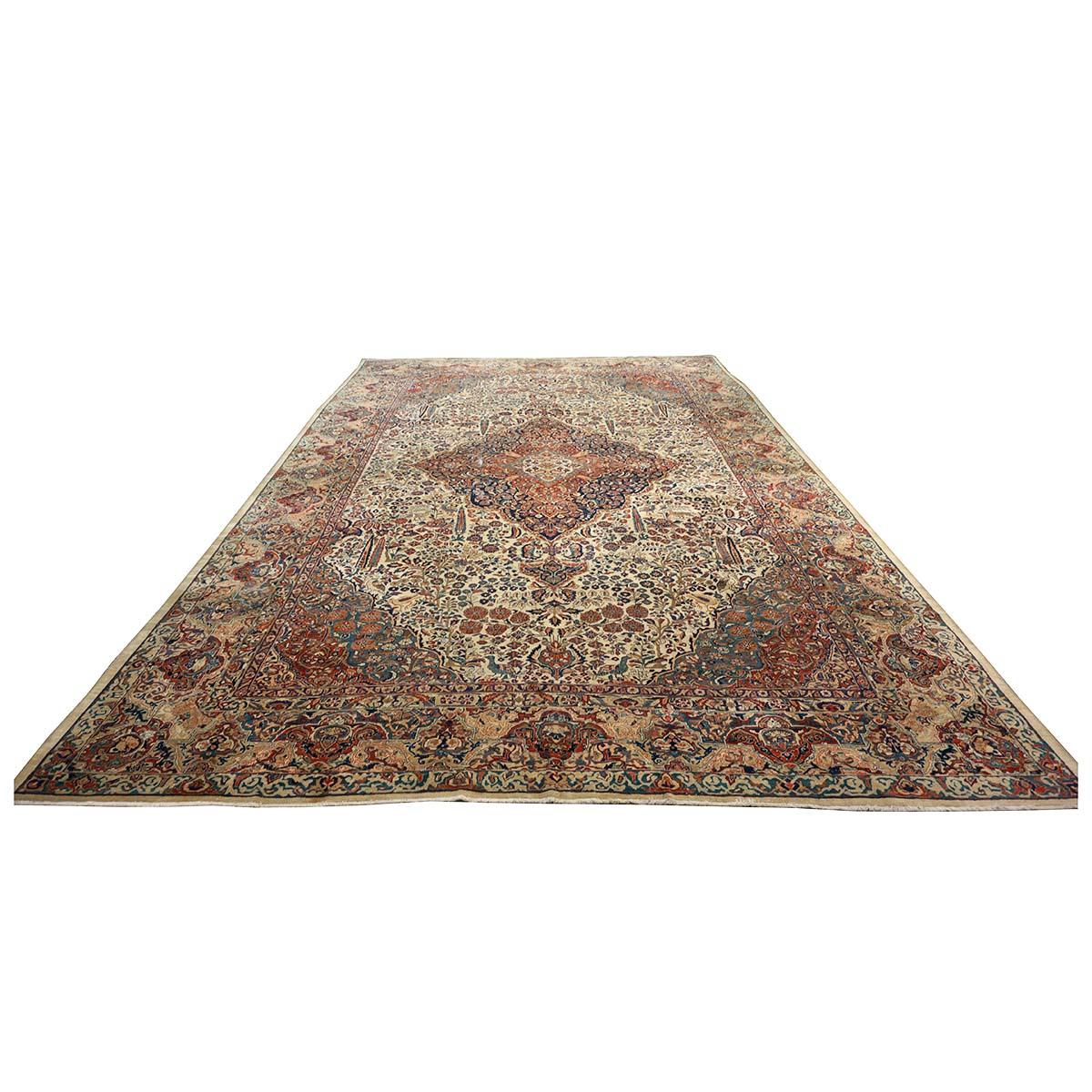 Ashly Fine Rugs presents an Antique Persian Sarouk Mahajaran 12x19 Oversized Area Rug. Mahajaran Sarouk rugs were woven in central Persia’s Sultanabad (later called Arak) province. This 100-year-old rug has a rare, beautiful ivory background with