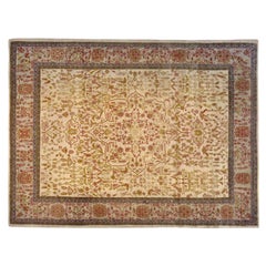 Tapis persan ancien de style Sarouk oriental, de taille normale, avec médaillon central