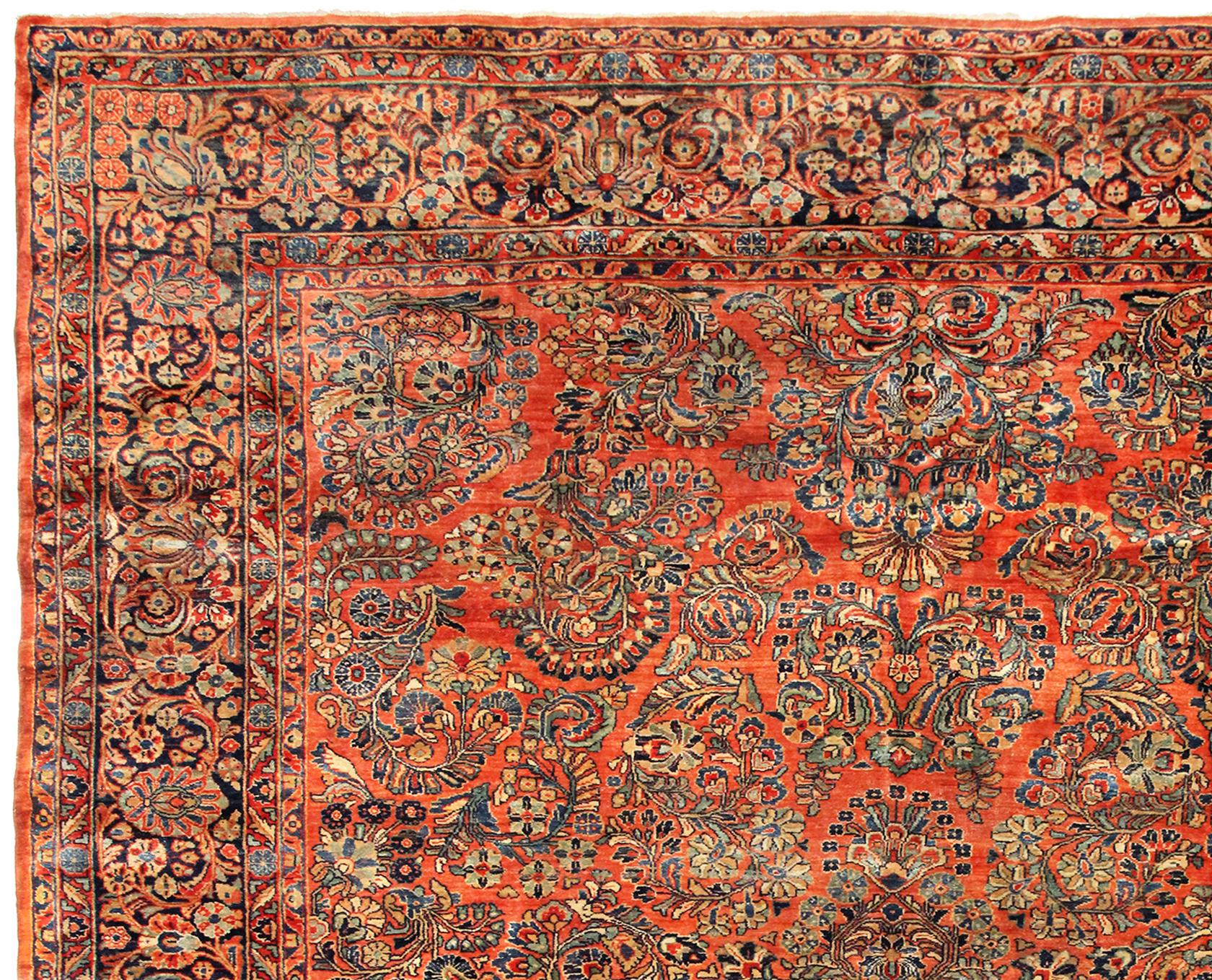 Wool Antique Persian Sarouk Oriental Rug, in Room Size, with Coral Tones, circa 1920 For Sale