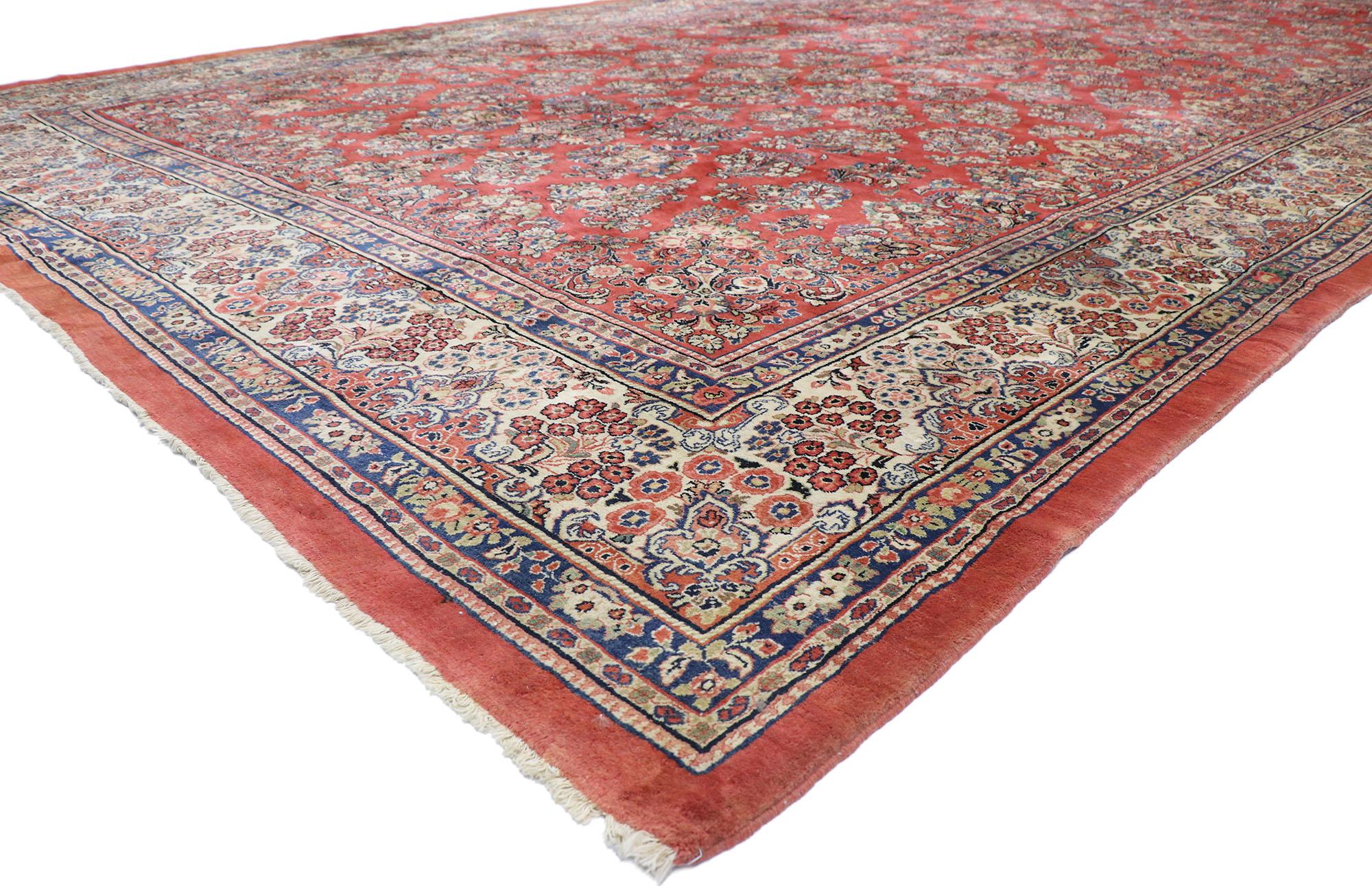 74401 Oversized Antique Persian Sarouk Rug, 11'08 x 22'10. 
With architectural elements of naturalistic flowers and an opulent color scheme, this hand-knotted wool antique Persian Sarouk Palace size rug embodies an American Colonial style. Starting