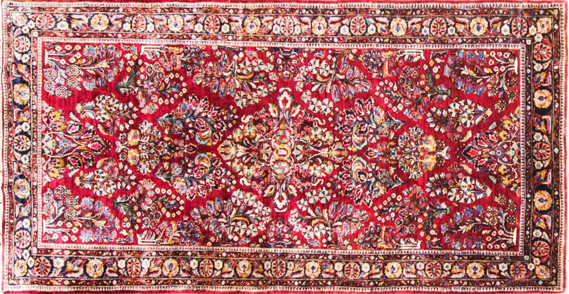 Sarouk rug, circa 1930s, very fine with high density of knots and soft, vegetable dye wool, unpainted Sarouk, .in excellent condition. A nice soft tone of red and blue background colors with symmetrical floral pattern
The materials are wool pile