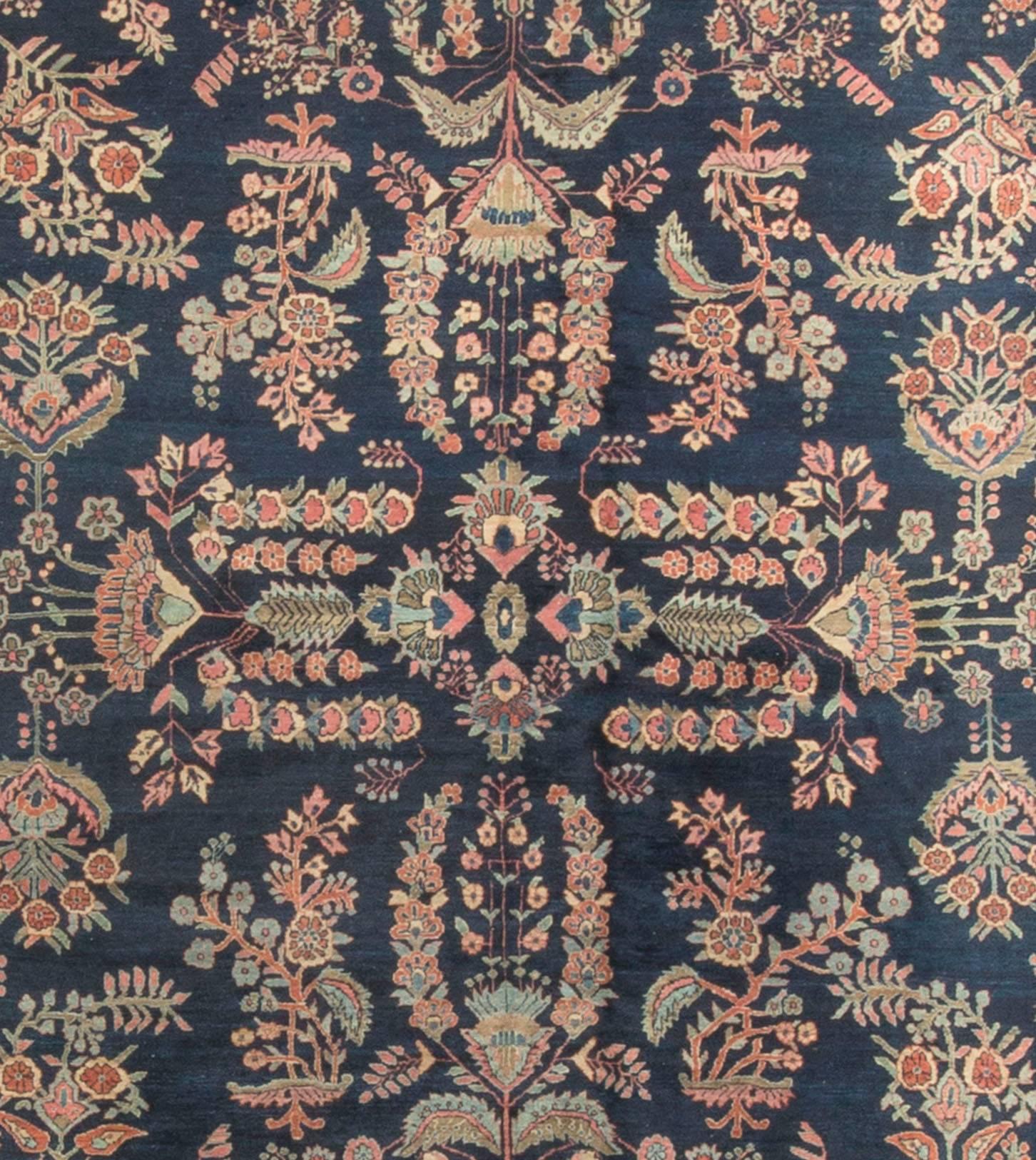 Antique Persian Sarouk rug. Measures: 9' x 12'10. Sarouk rugs are from the village of Saruk about 25 miles north of Arak, in west Persia. Sarouk rugs have been produced for much of the last century. Sarouk’s are normally a very thick and dense heavy