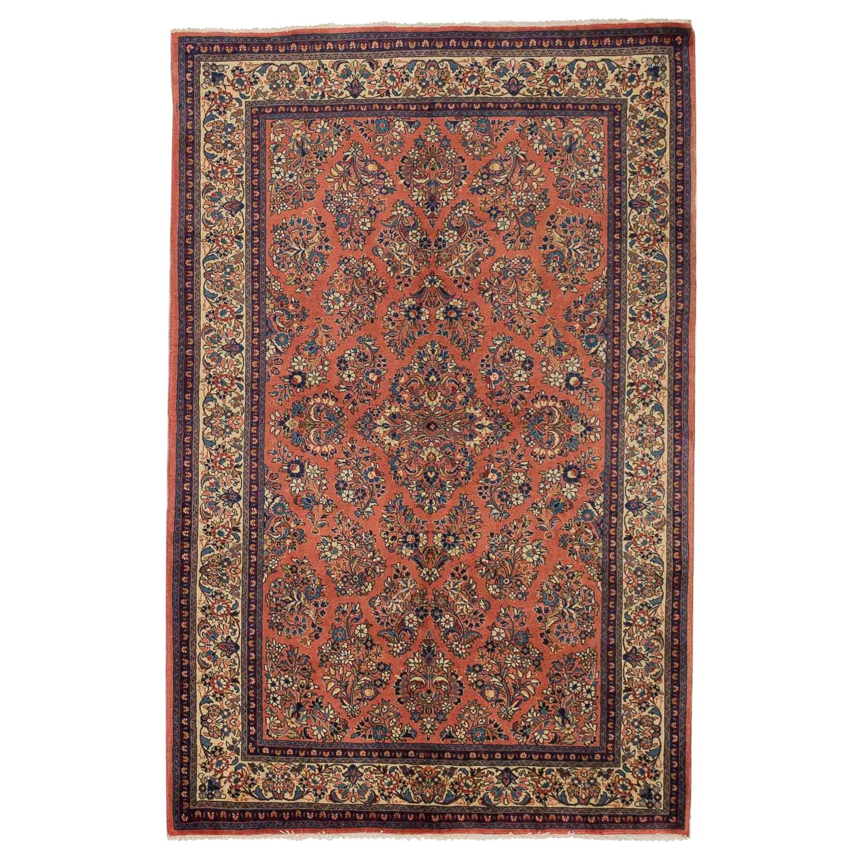 Antique Persian Sarouk Rug with Blue and Ivory Flower Heads on Red Center Field