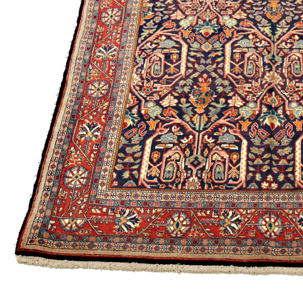 Hand-Woven Antique Persian Sarouk Rug with Colored Botanical Details on Navy Blue Field For Sale
