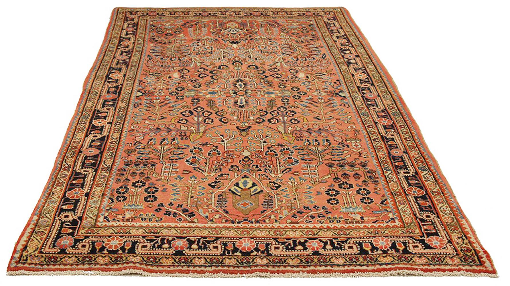 Antique Persian rug handwoven from the finest sheep’s wool and colored with all-natural vegetable dyes that are safe for humans and pets. It’s a traditional Sarouk design featuring flower details using a lovely mix of blue, navy, red and ivory. It